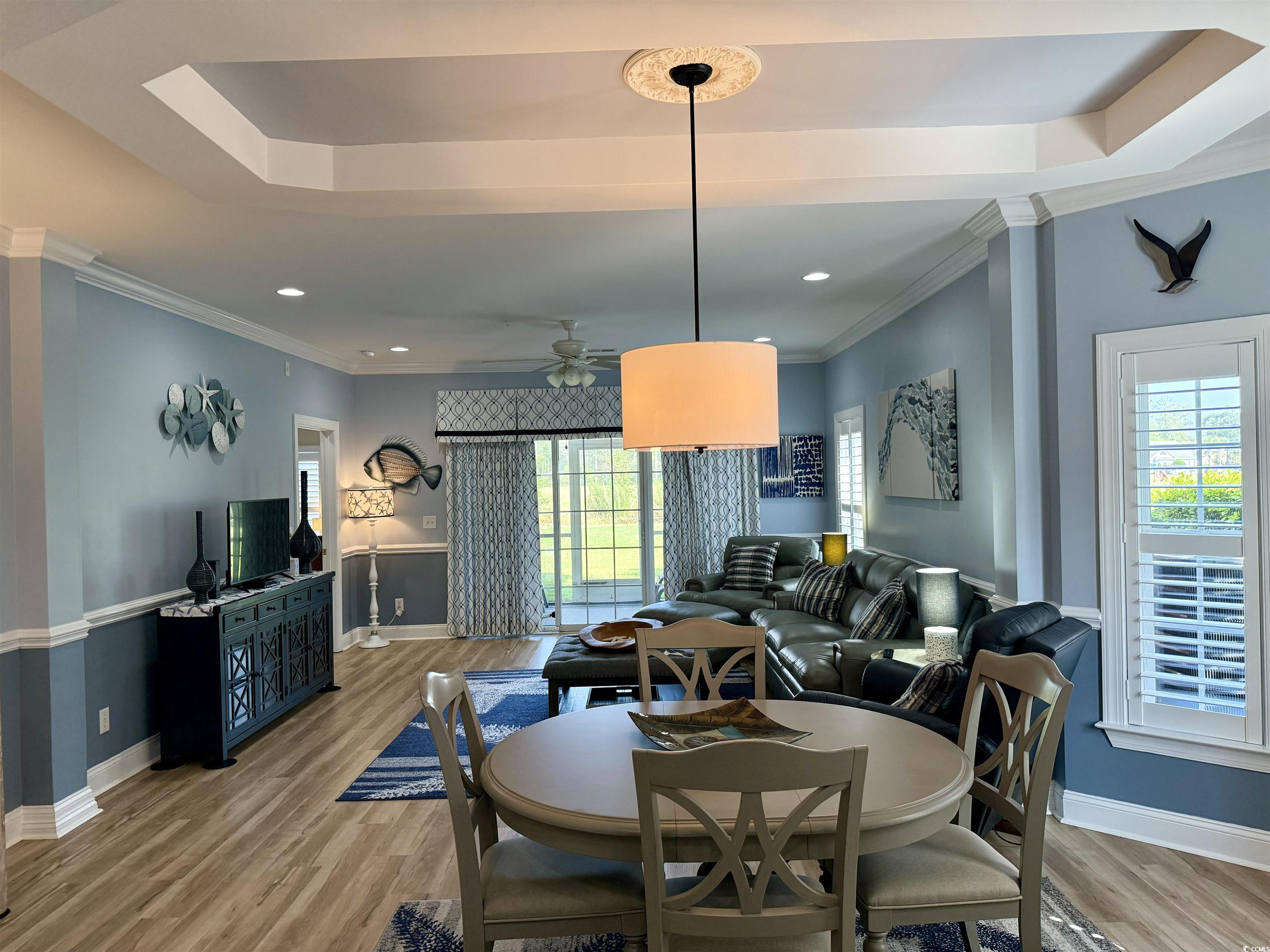 1008 Ray Costin Way, Unit 305 Murrells Inlet, SC 29576 - Photo 14 of 31 Dining area with ornamental molding, wood-type flo