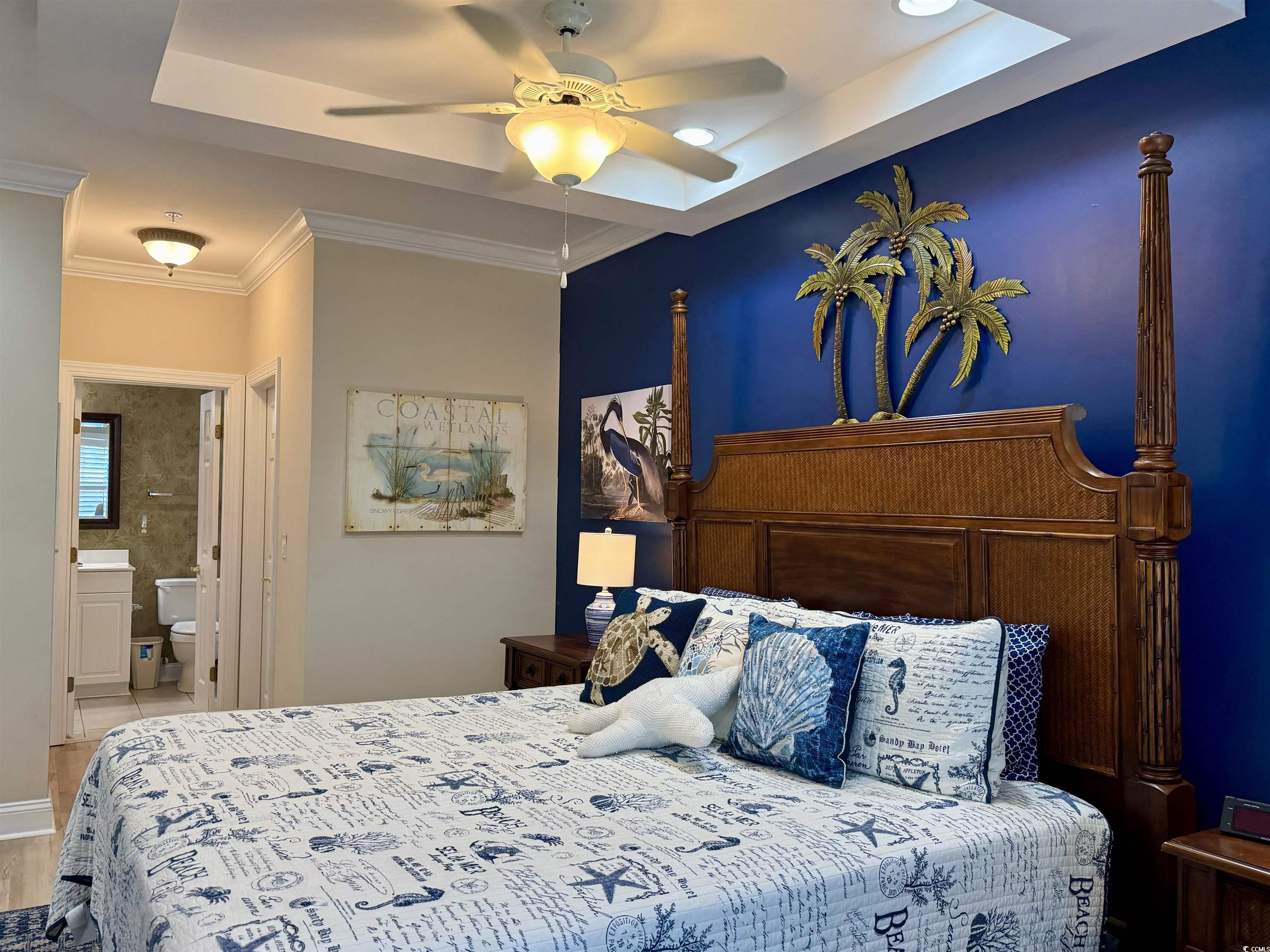 1008 Ray Costin Way, Unit 305 Murrells Inlet, SC 29576 - Photo 19 of 31 Bedroom with ensuite bathroom, ornamental molding,