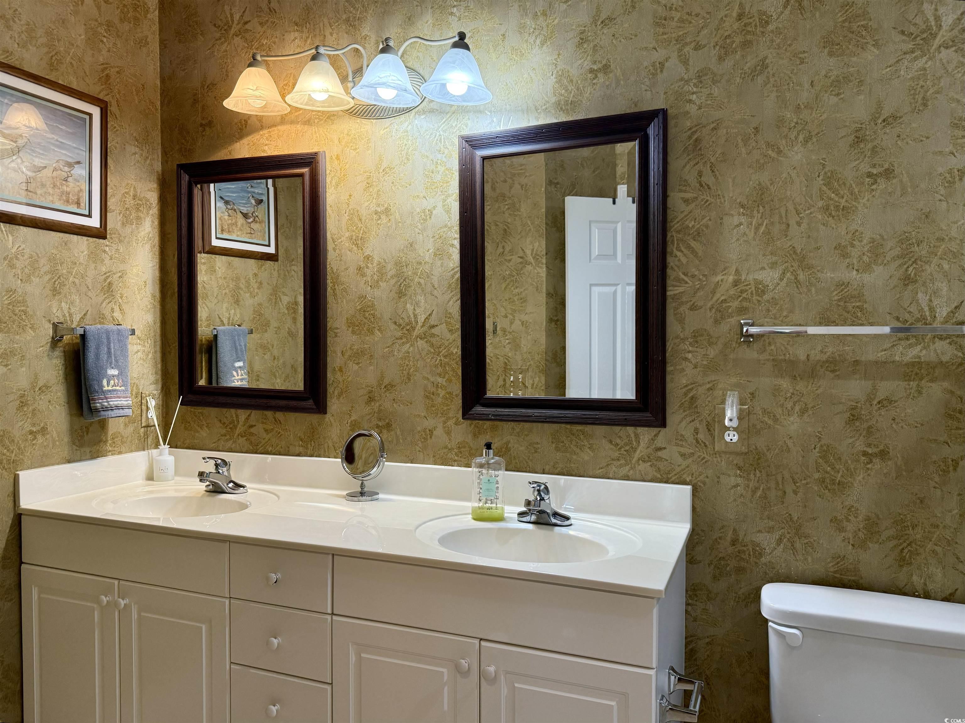 1008 Ray Costin Way, Unit 305 Murrells Inlet, SC 29576 - Photo 20 of 31 Bathroom with toilet and vanity