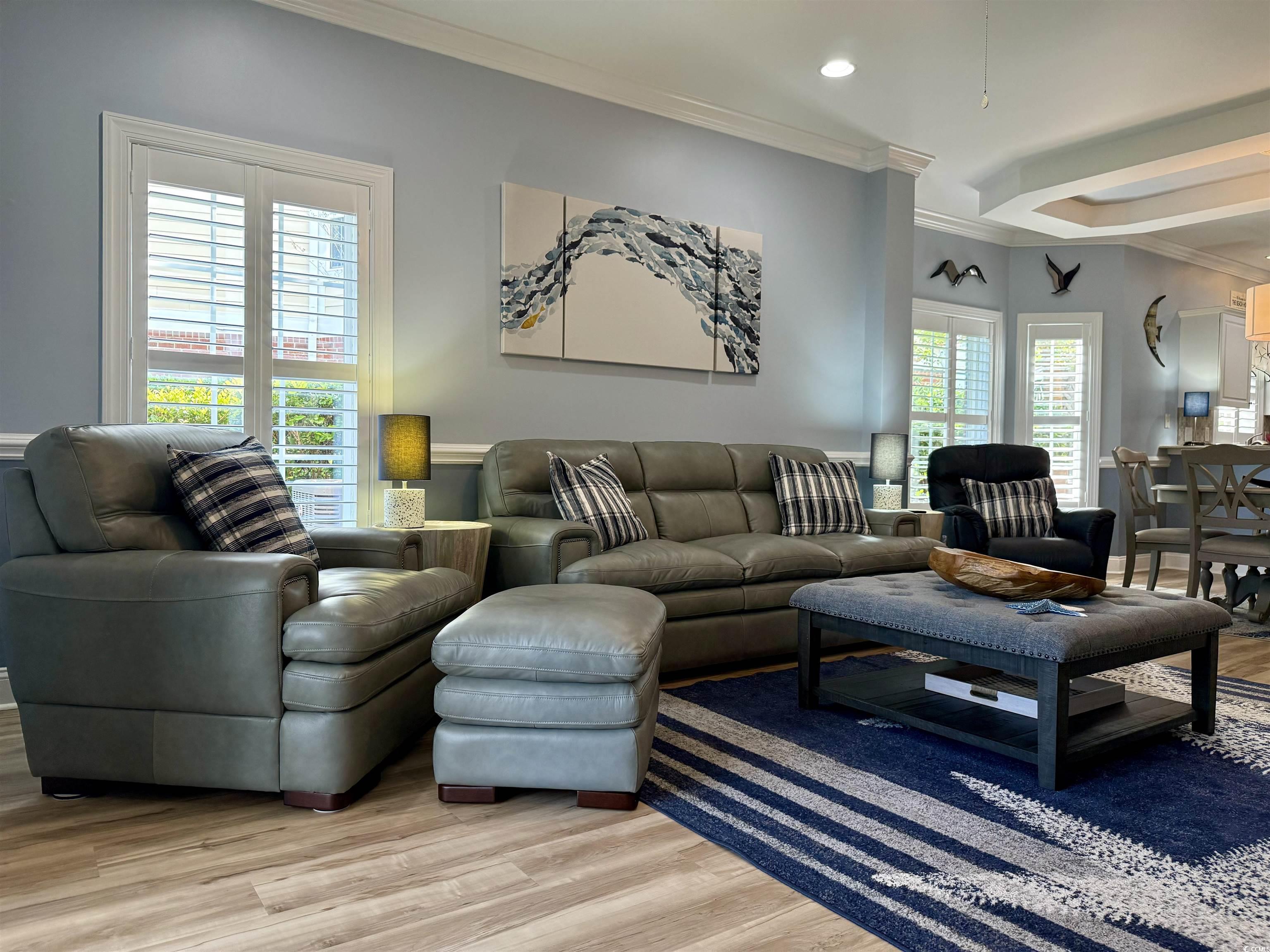 1008 Ray Costin Way, Unit 305 Murrells Inlet, SC 29576 - Photo 22 of 31 Living room with crown molding, light hardwood / w