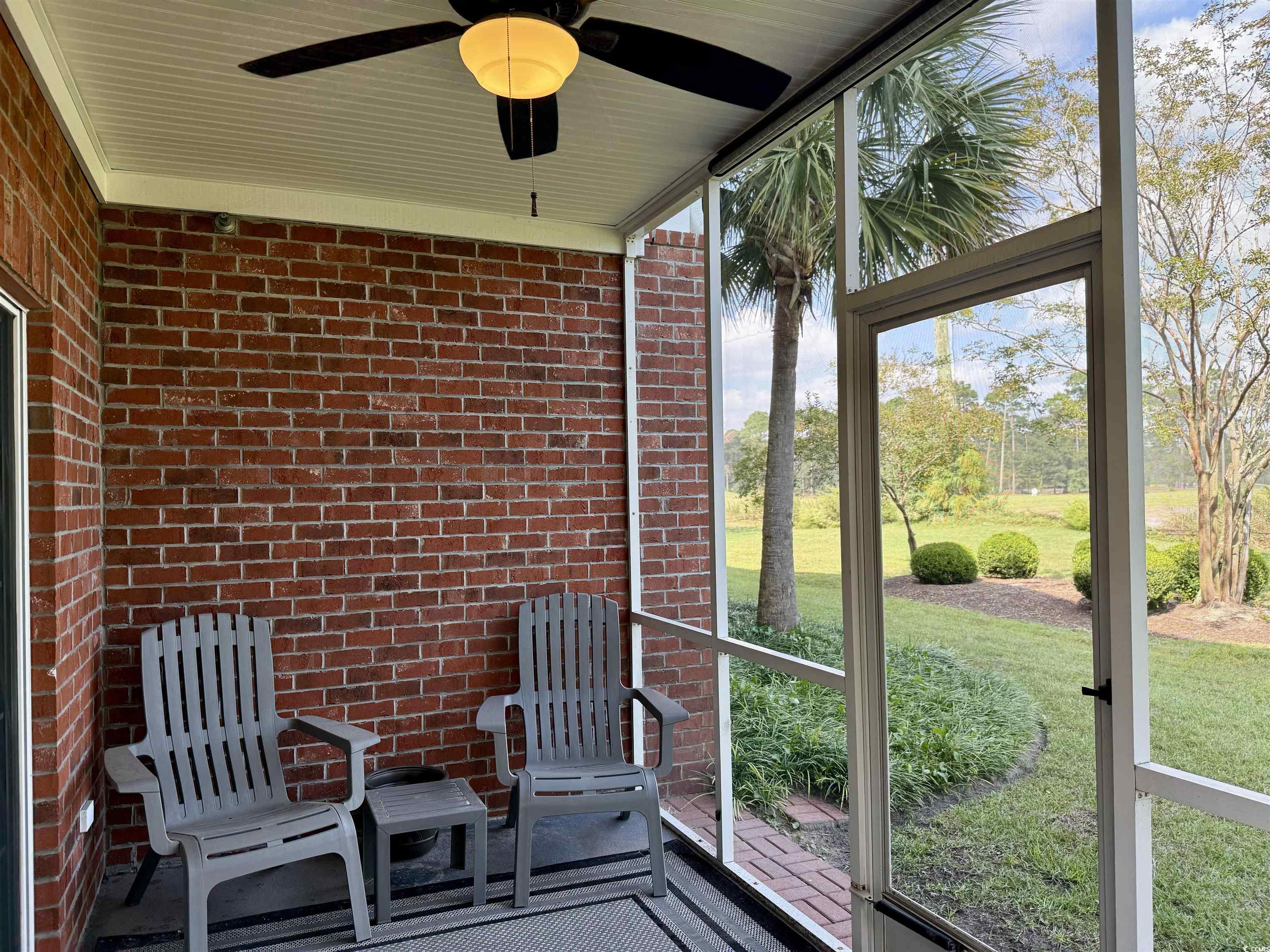 1008 Ray Costin Way, Unit 305 Murrells Inlet, SC 29576 - Photo 25 of 31 Unfurnished sunroom with ceiling fan