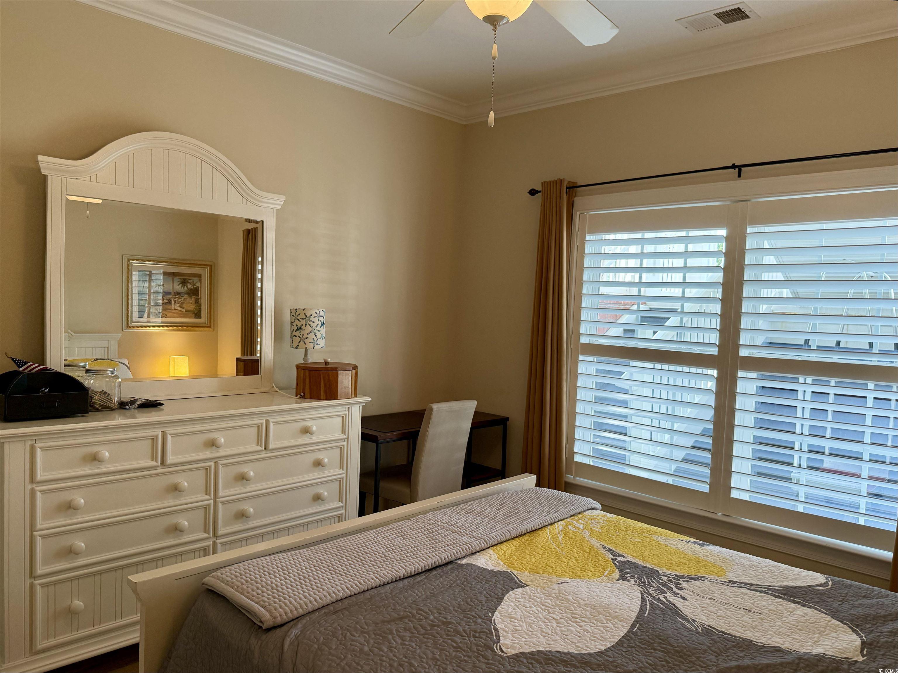 1008 Ray Costin Way, Unit 305 Murrells Inlet, SC 29576 - Photo 8 of 31 Bedroom featuring ornamental molding and ceiling f