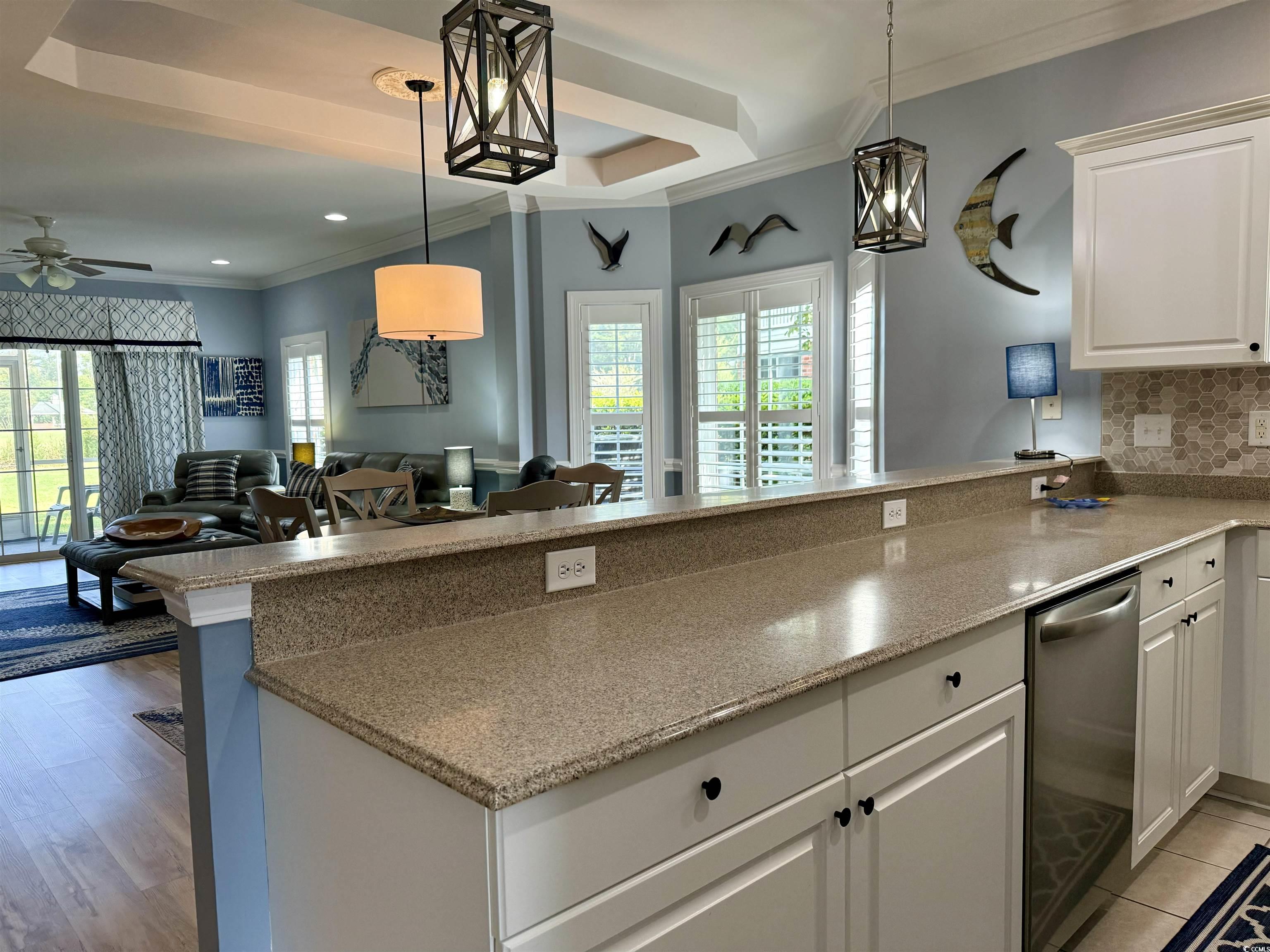 1008 Ray Costin Way, Unit 305 Murrells Inlet, SC 29576 - Photo 10 of 31 Kitchen with light wood-type flooring, a raised ce