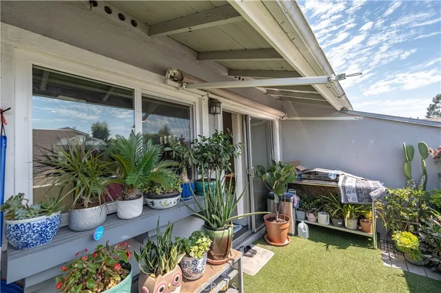 a view of swimming pool with outdoor seating and plants