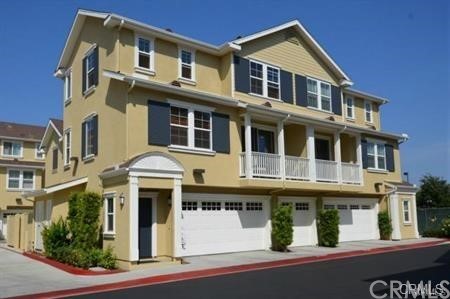 a front view of a residential apartment building with a yard