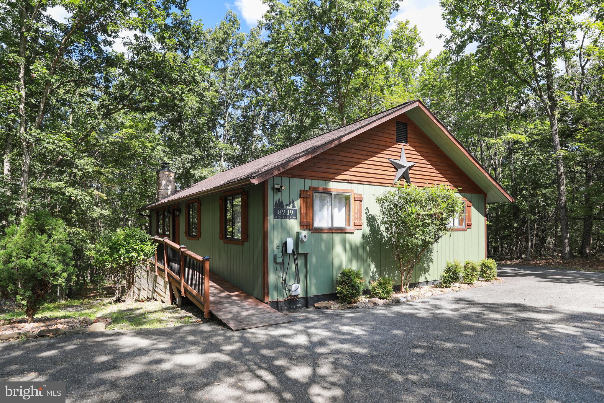 8249 Supinlick Ridge Road Mount Jackson, VA 22842 - Photo 3 of 40 a view of a small house with a tree in the background