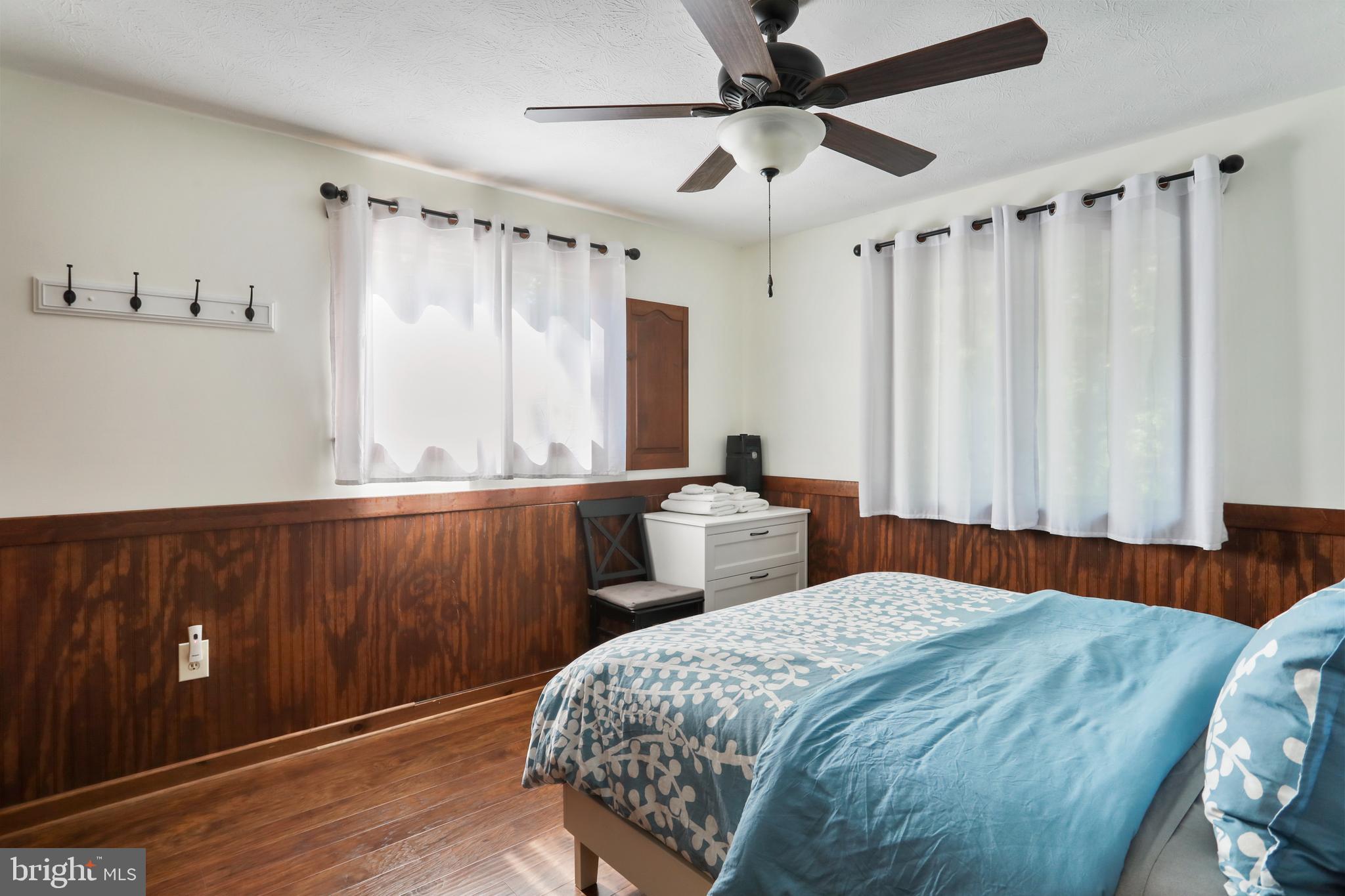 8249 Supinlick Ridge Road Mount Jackson, VA 22842 - Photo 32 of 40 a bedroom with a large bed and a window
