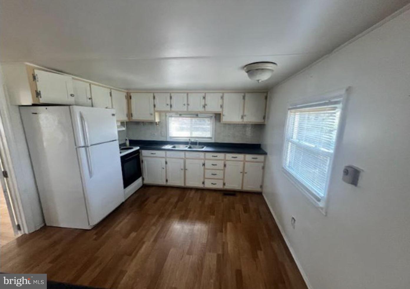 236 South Tuckahoe Road Williamstown, NJ 08094 - Photo 14 of 27 a kitchen with wooden floors and white appliances