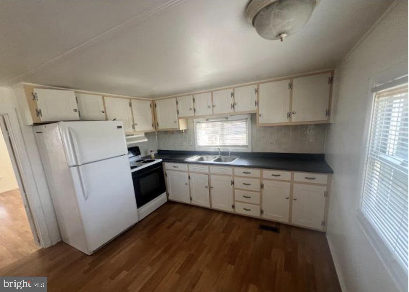 236 South Tuckahoe Road Williamstown, NJ 08094 - Photo 16 of 27 a kitchen with granite countertop white cabinets and white appliances