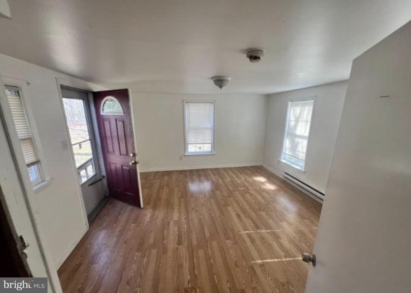 236 South Tuckahoe Road Williamstown, NJ 08094 - Photo 17 of 27 wooden floor in an empty room with a window