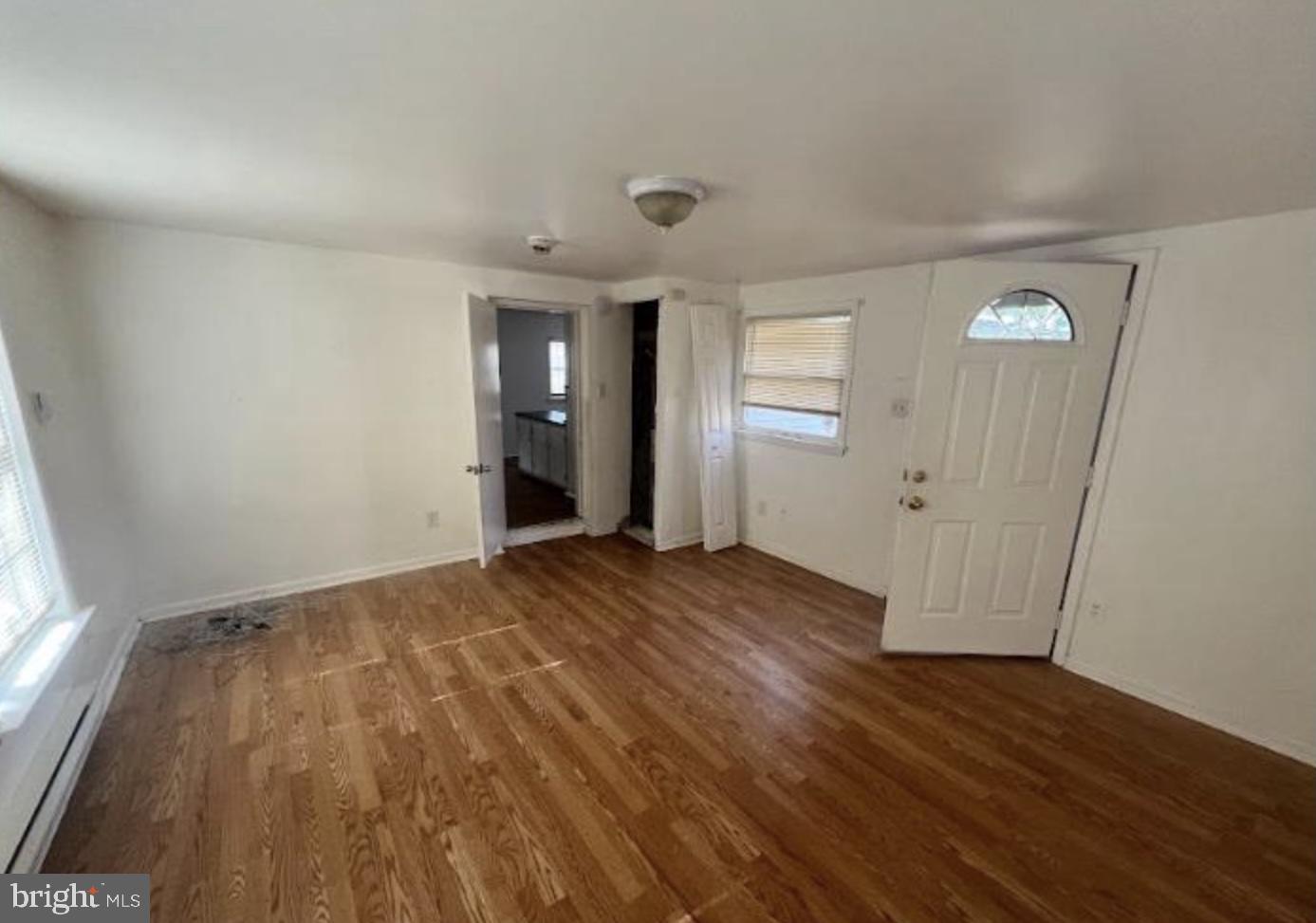 236 South Tuckahoe Road Williamstown, NJ 08094 - Photo 20 of 27 an empty room with wooden floor and windows