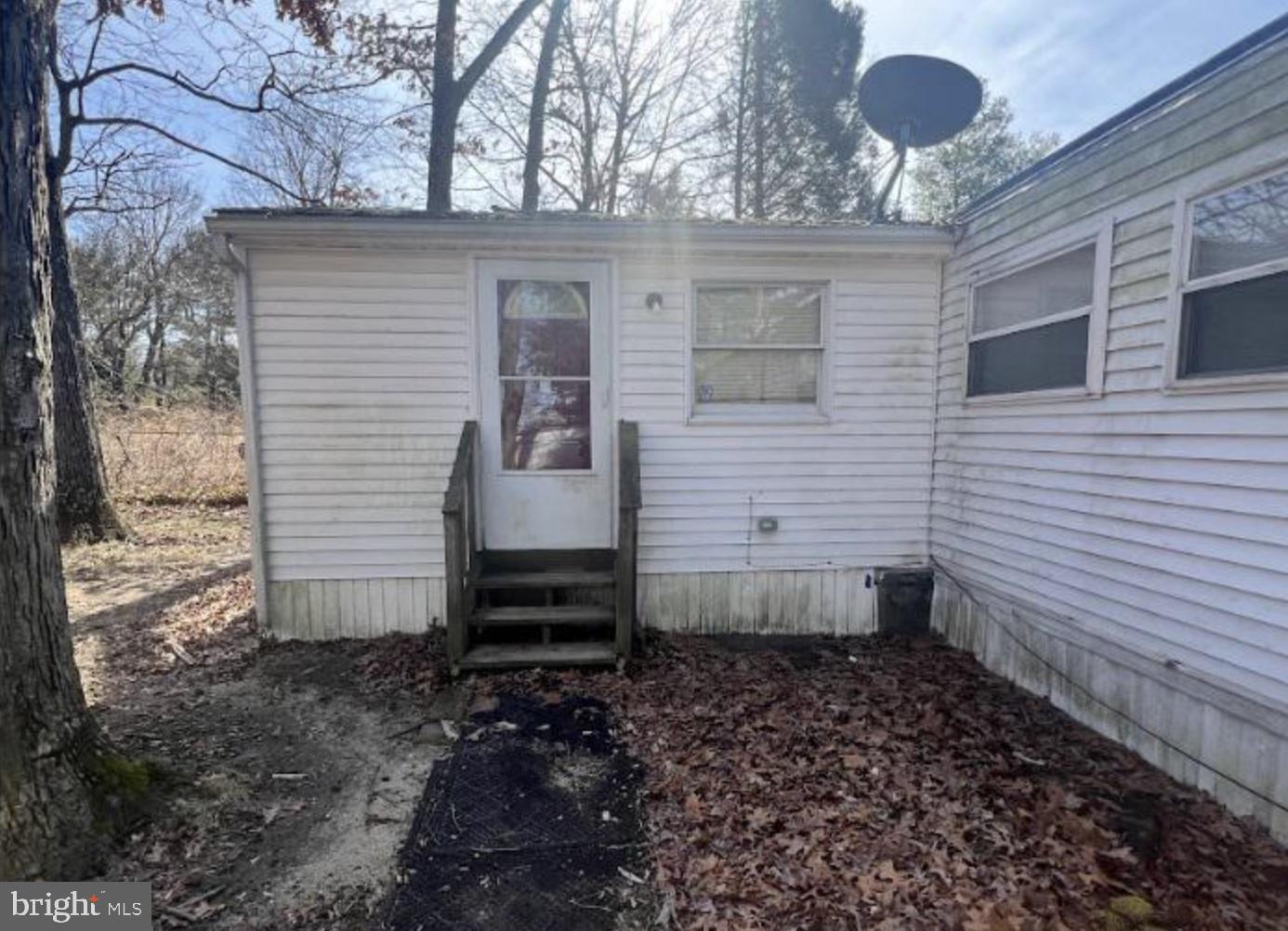 236 South Tuckahoe Road Williamstown, NJ 08094 - Photo 8 of 27 a front view of a house with a garden