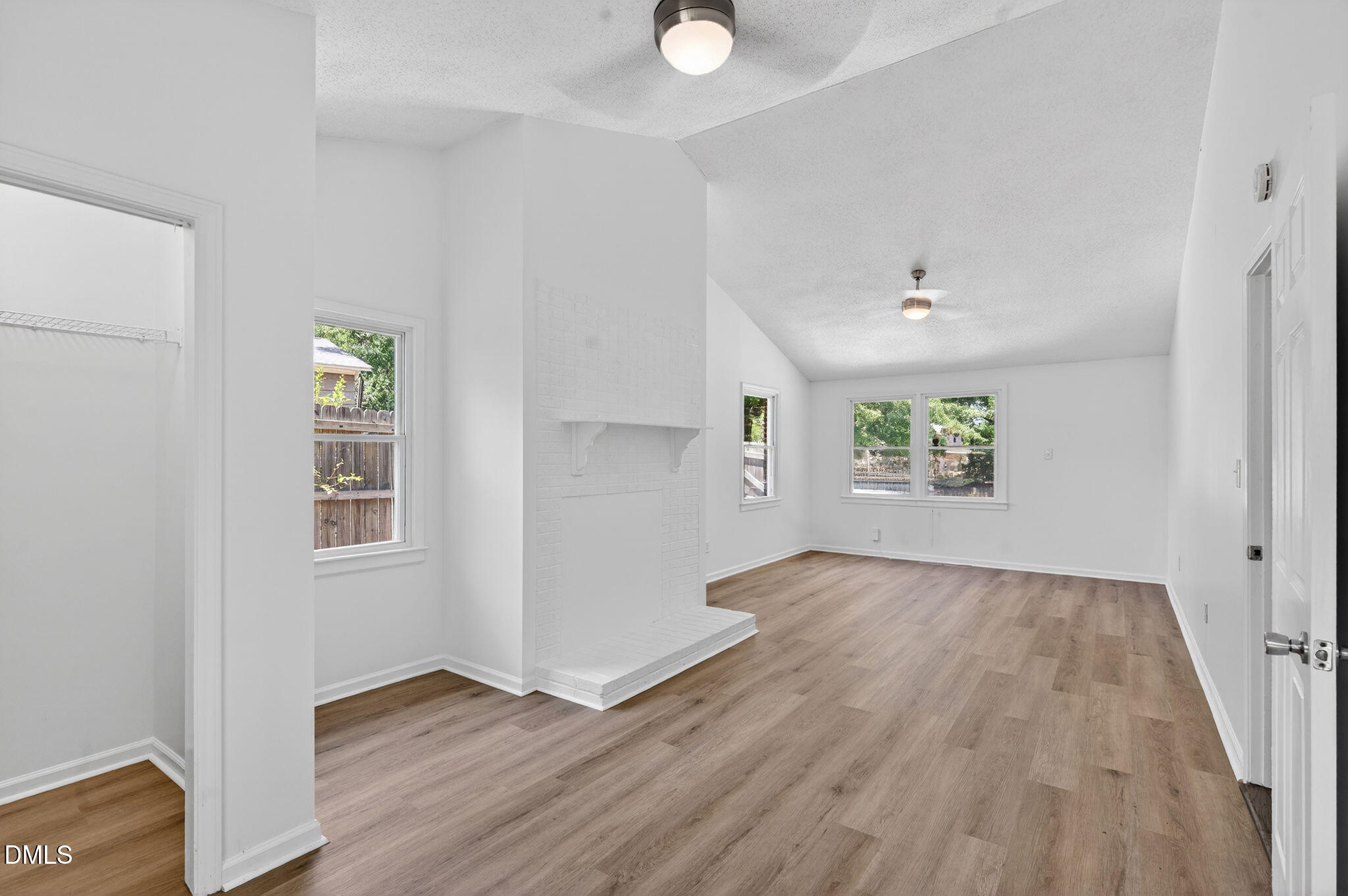 904 Seabrook Road Raleigh, NC 27610 - Photo 22 of 31 an empty room with wooden floor and windows