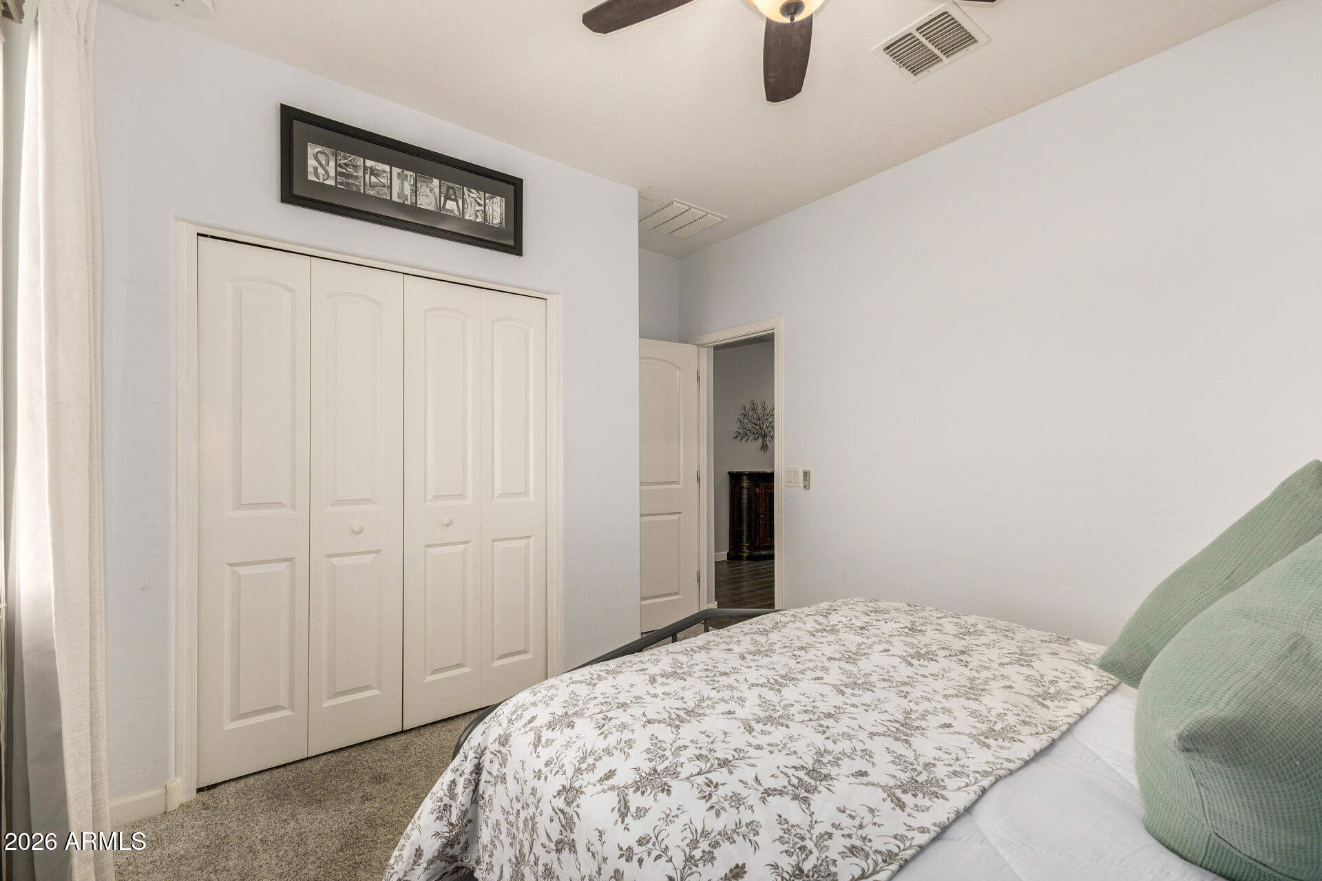41039 West Williams Way Maricopa, AZ 85138 - Photo 15 of 25 a bedroom with a bed and a cabinet