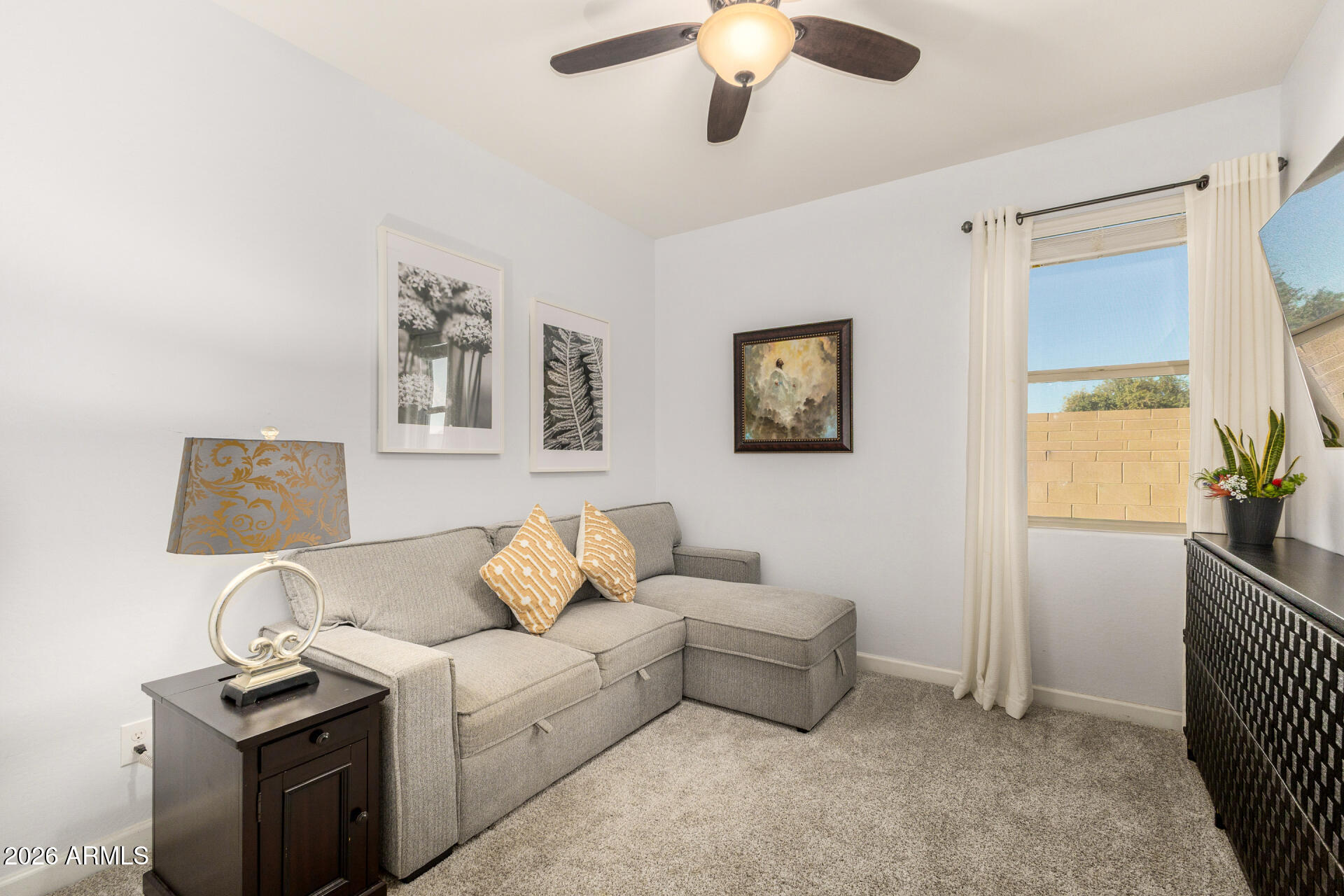 41039 West Williams Way Maricopa, AZ 85138 - Photo 16 of 25 a living room with furniture and a window