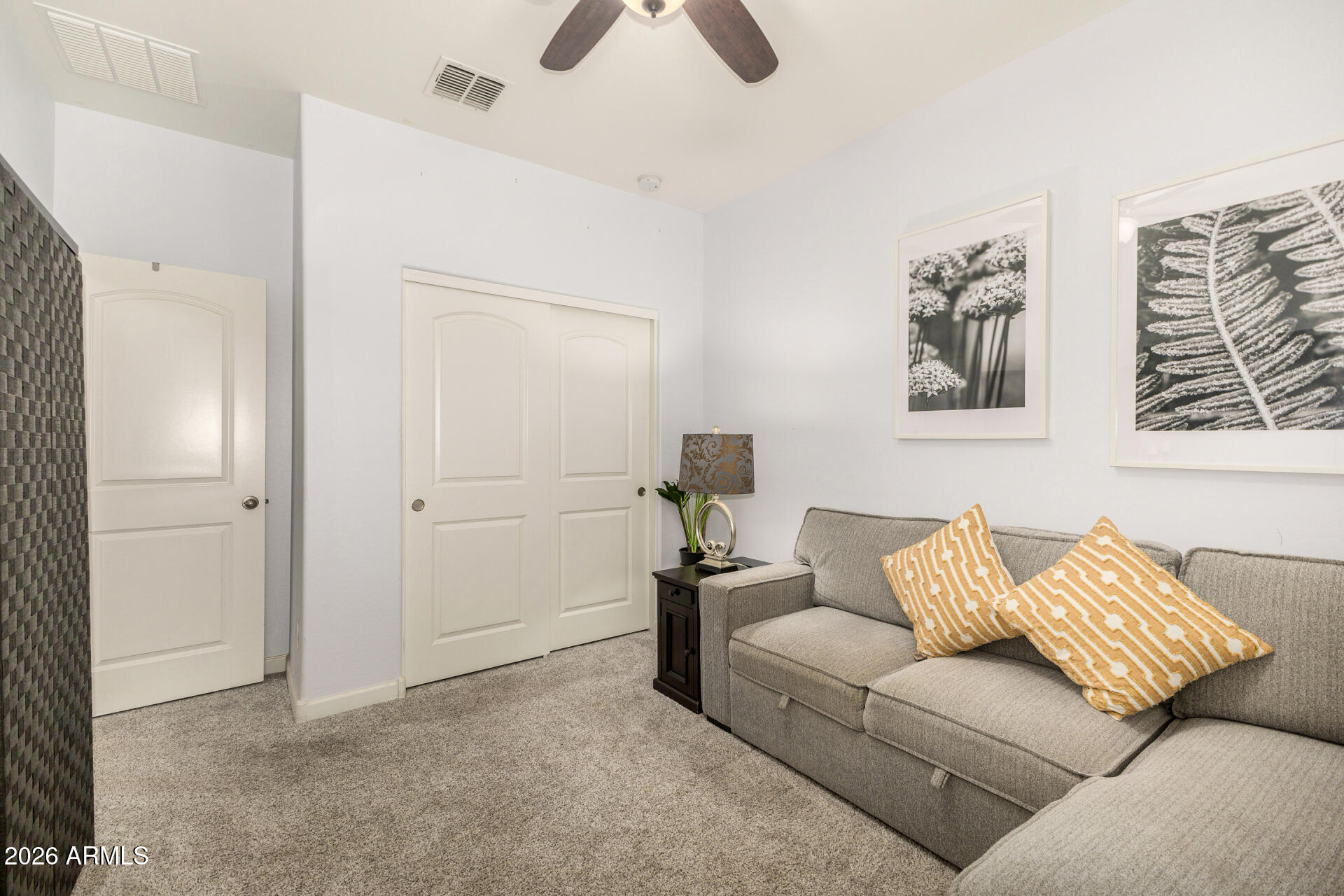 41039 West Williams Way Maricopa, AZ 85138 - Photo 17 of 25 a living room with furniture and ceiling fan