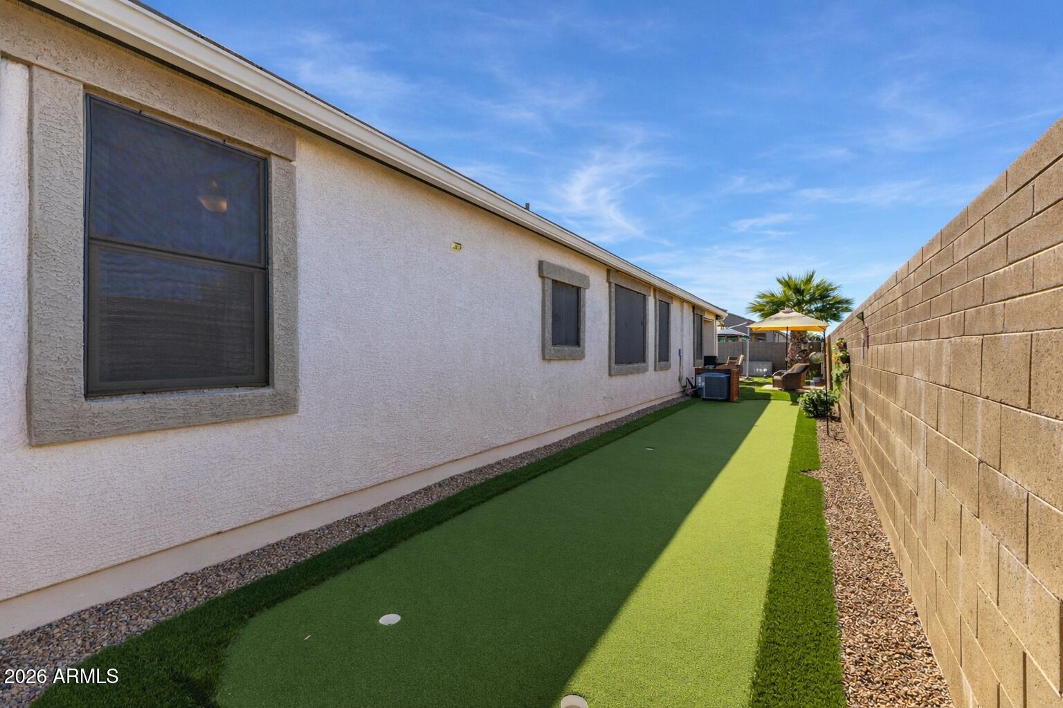 41039 West Williams Way Maricopa, AZ 85138 - Photo 23 of 25 a view of a backyard with a garden