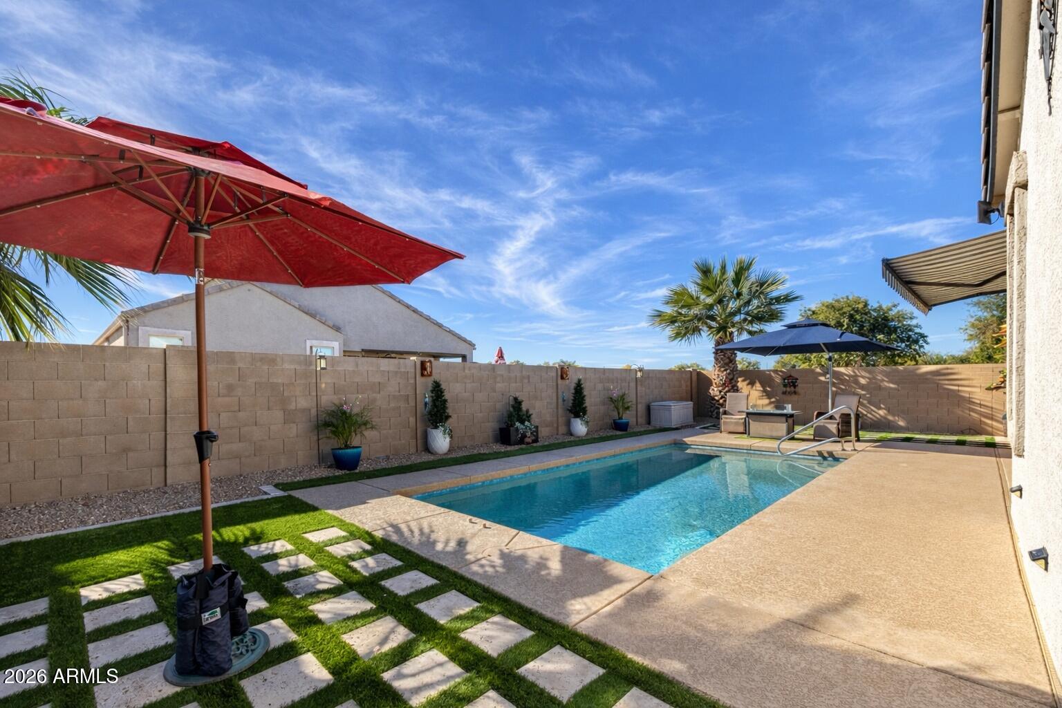 41039 West Williams Way Maricopa, AZ 85138 - Photo 24 of 25 a view of a backyard with a patio and fire pit