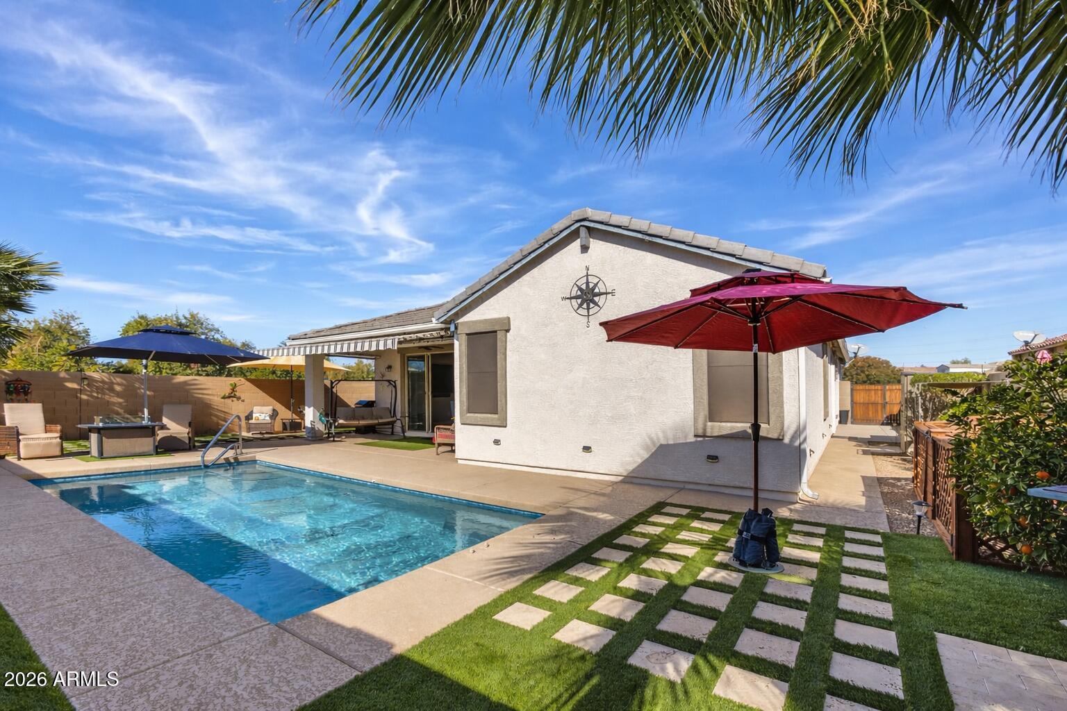 41039 West Williams Way Maricopa, AZ 85138 - Photo 25 of 25 an outdoor space with furniture and umbrella