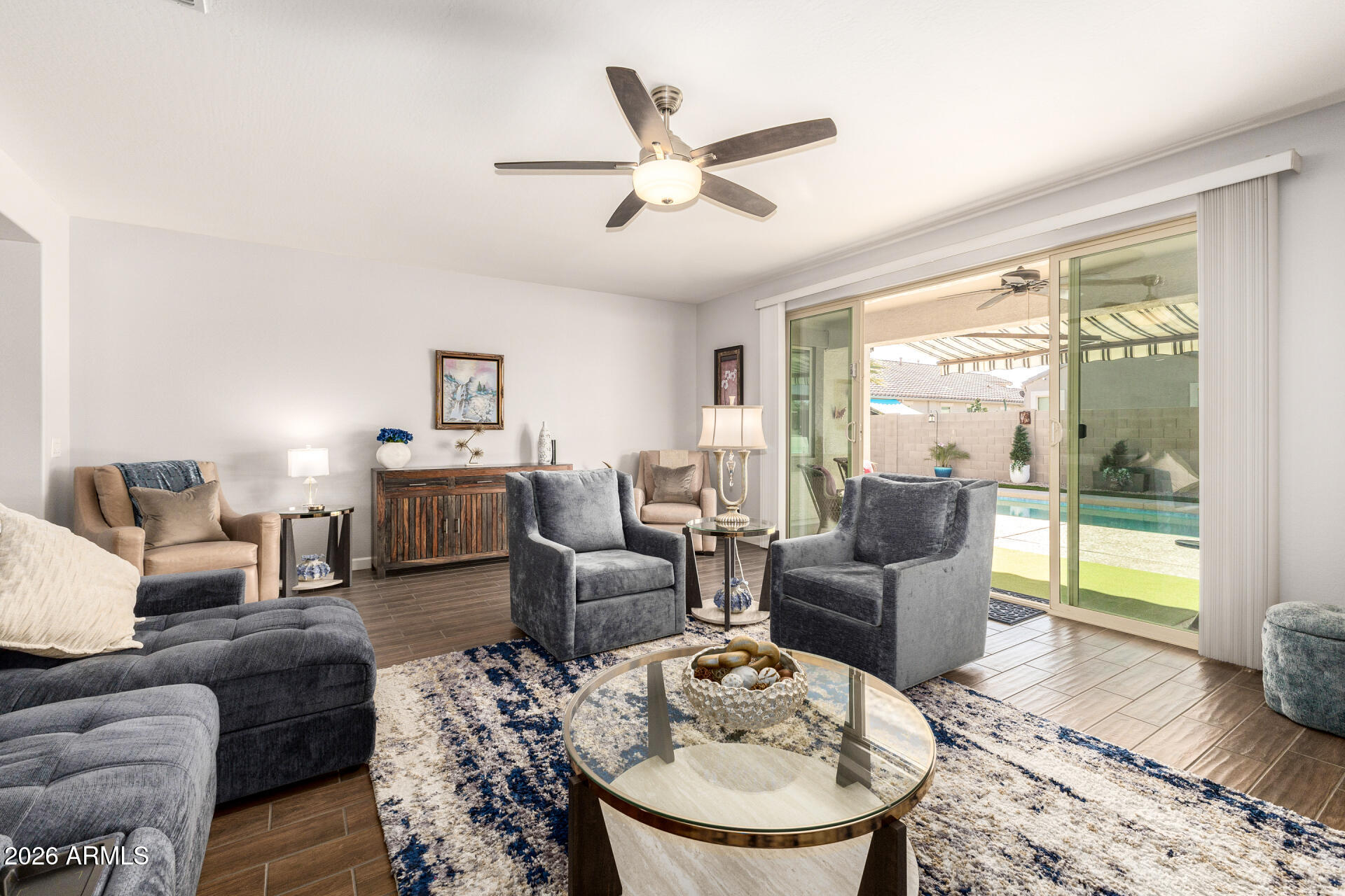 41039 West Williams Way Maricopa, AZ 85138 - Photo 3 of 25 a living room with furniture and a large window