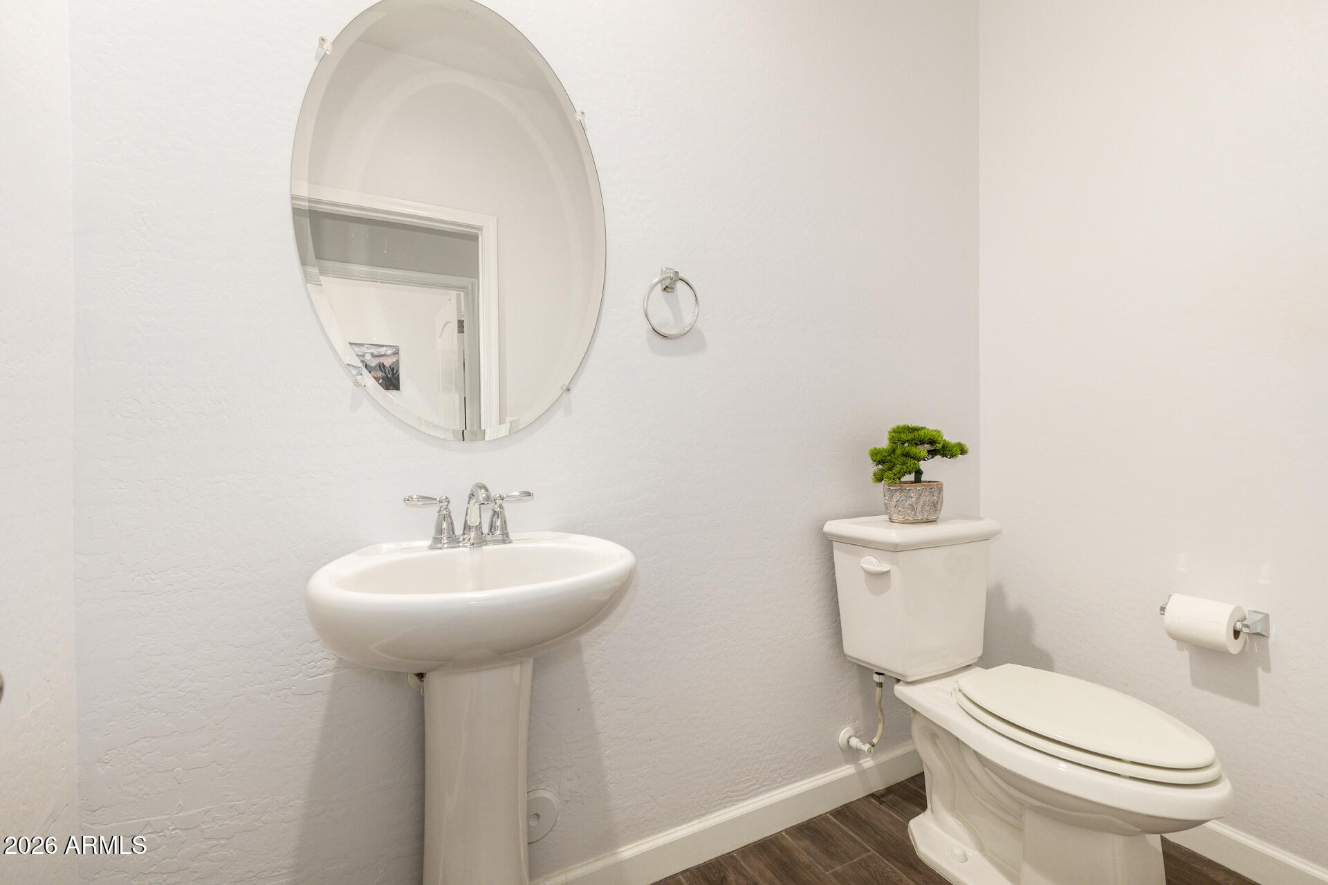 41039 West Williams Way Maricopa, AZ 85138 - Photo 8 of 25 a bathroom with a sink toilet and a mirror
