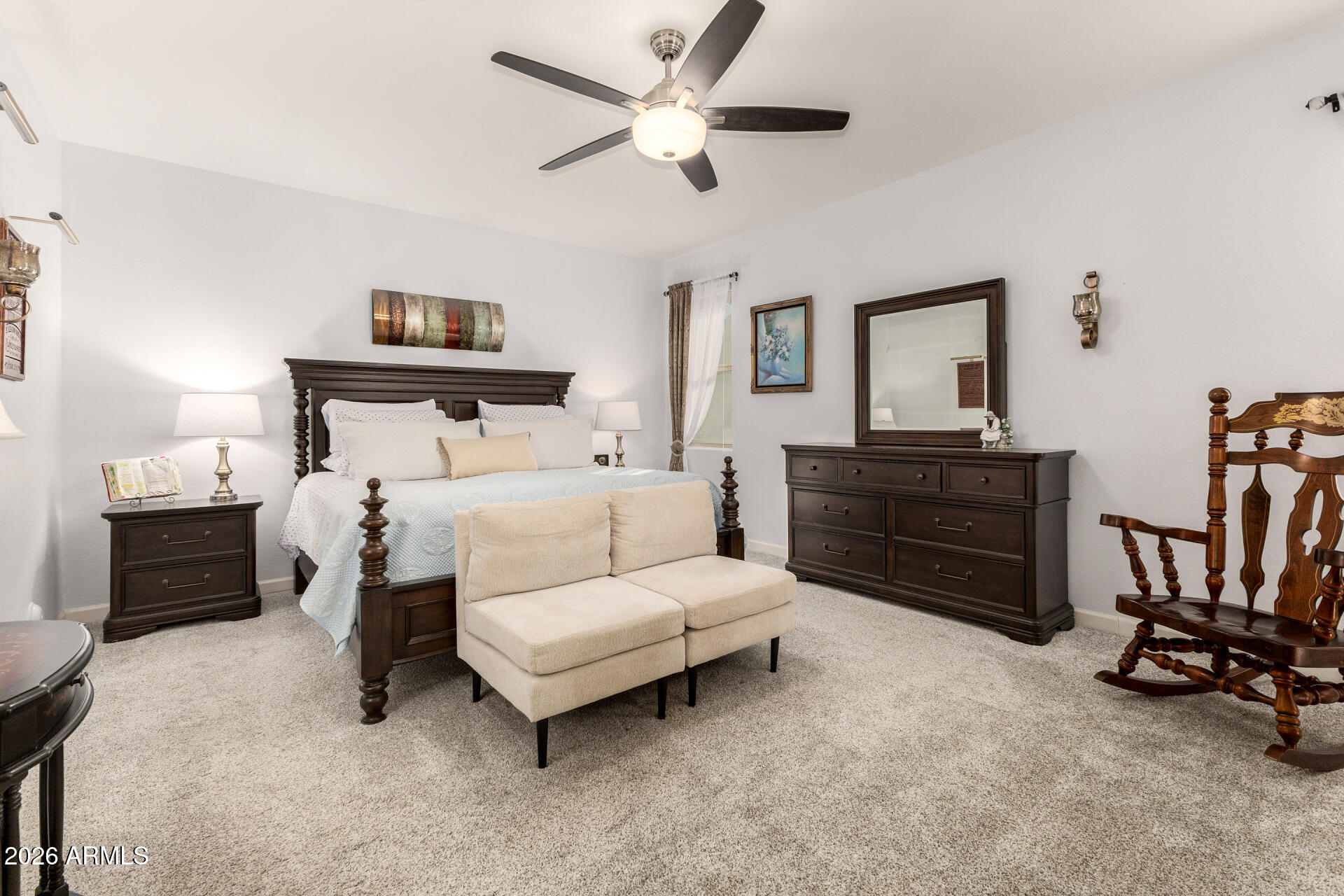 41039 West Williams Way Maricopa, AZ 85138 - Photo 9 of 25 a bedroom with bed and a chandelier