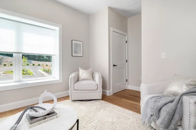 a bedroom with furniture and a window