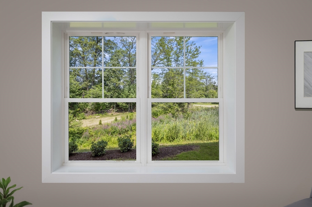 36 Old Louisquisset Pike, Unit 106 North Smithfield, RI 02896 - Photo 22 of 30 a view of a garden from a window