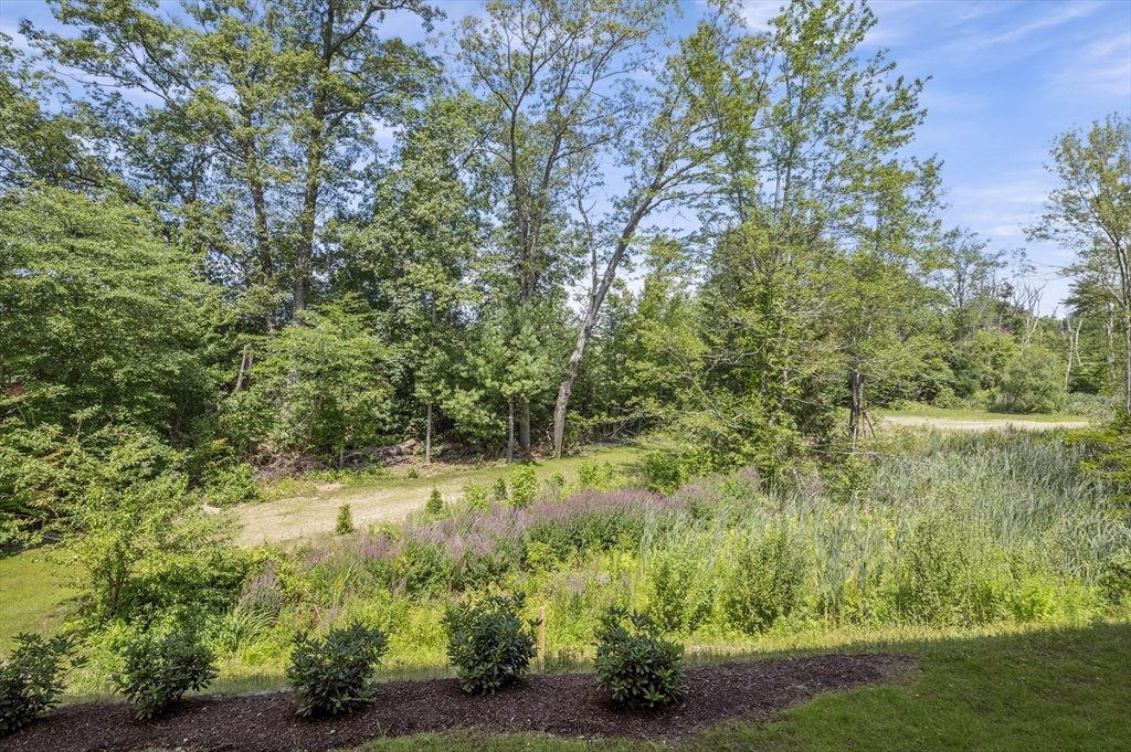 36 Old Louisquisset Pike, Unit 106 North Smithfield, RI 02896 - Photo 27 of 30 a view of a lake with a yard