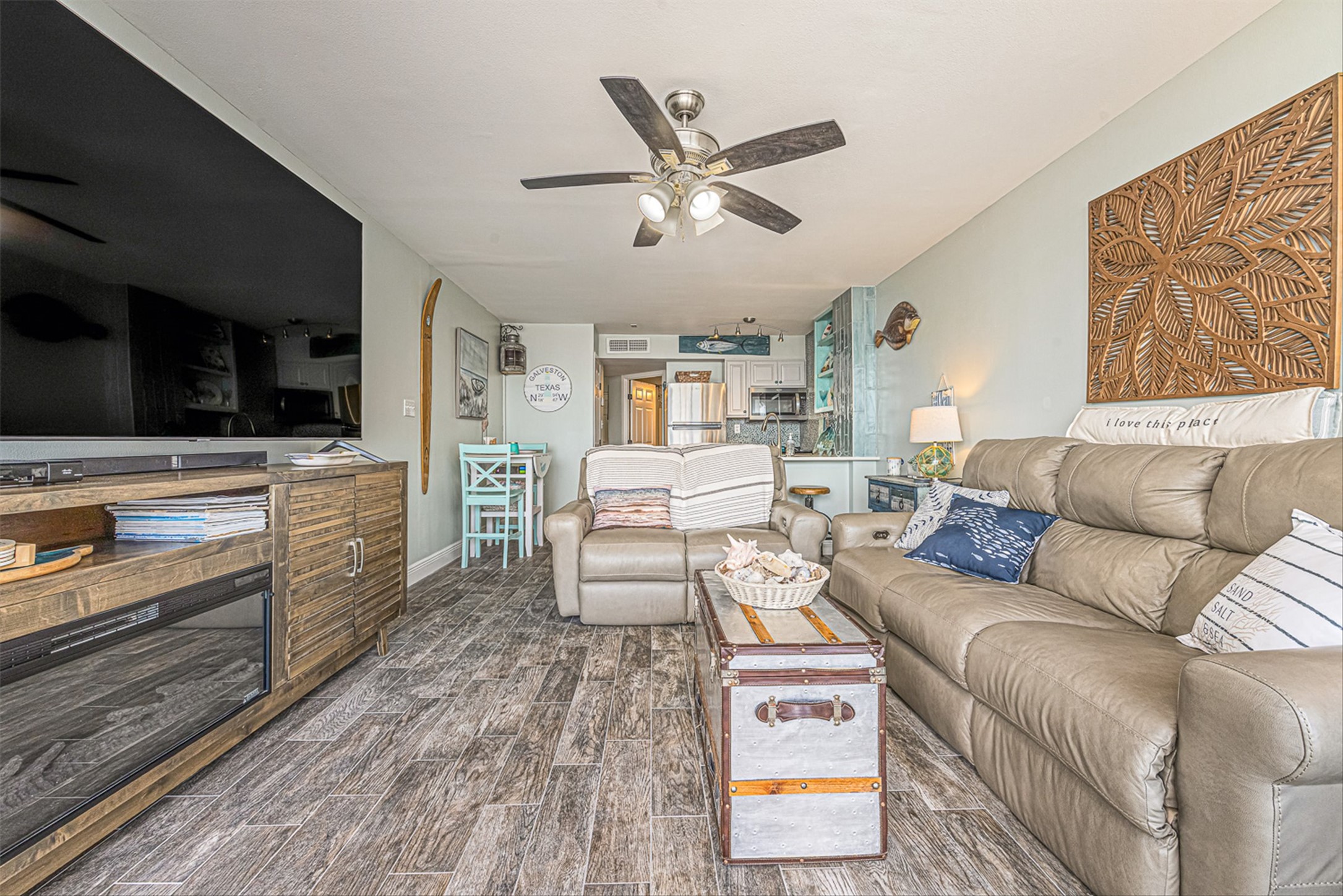 11945 Termini-San Luis Pass Road, Unit 406 Galveston, TX 77554 - Photo 12 of 26 Living room with ceiling fan and wood tiled floors