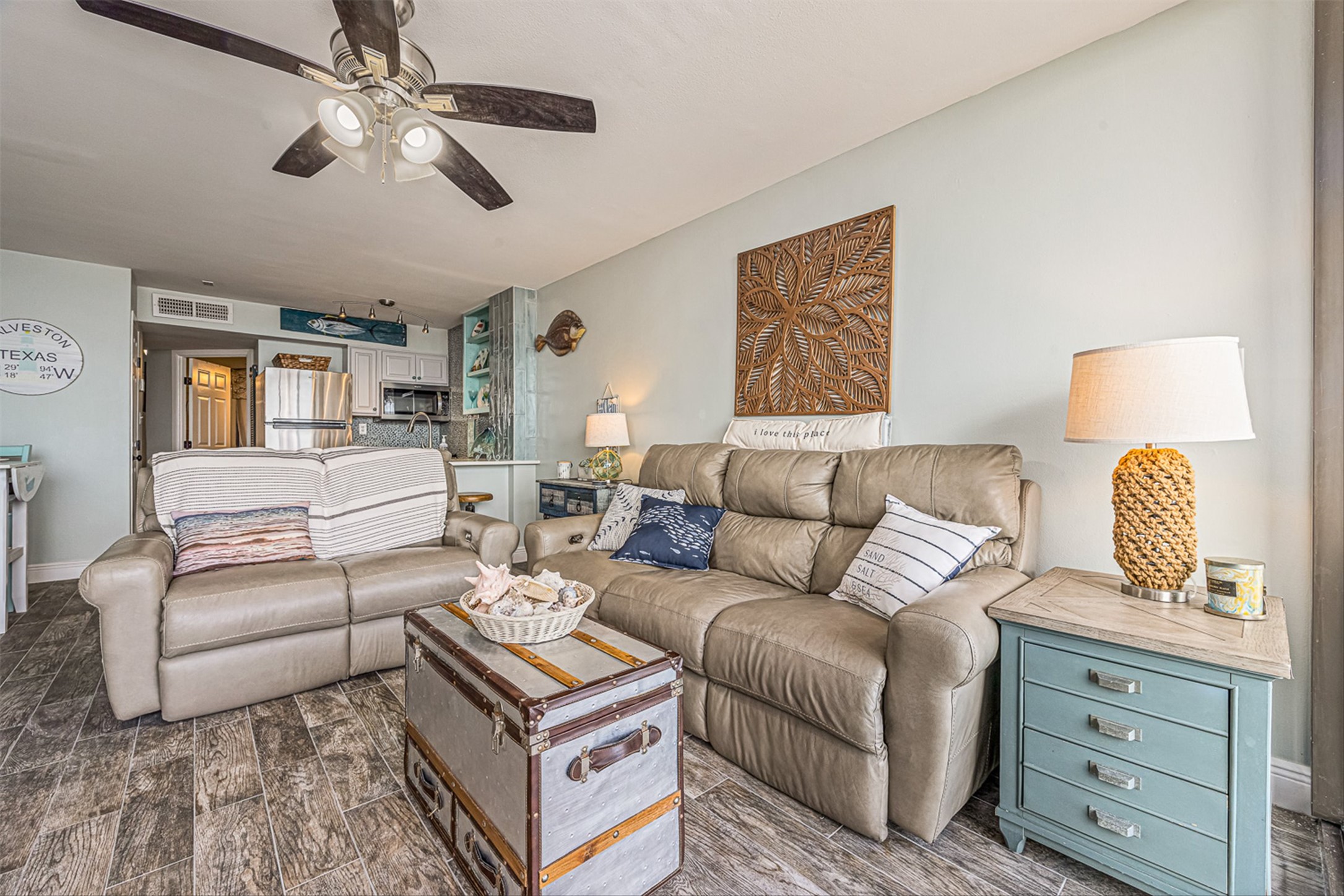 11945 Termini-San Luis Pass Road, Unit 406 Galveston, TX 77554 - Photo 13 of 26 Living area featuring wood finish floors and a ceiling fan