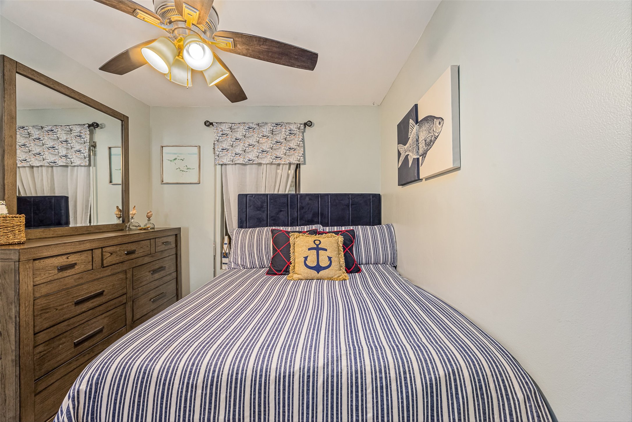 11945 Termini-San Luis Pass Road, Unit 406 Galveston, TX 77554 - Photo 21 of 26 Bedroom with ceiling fan