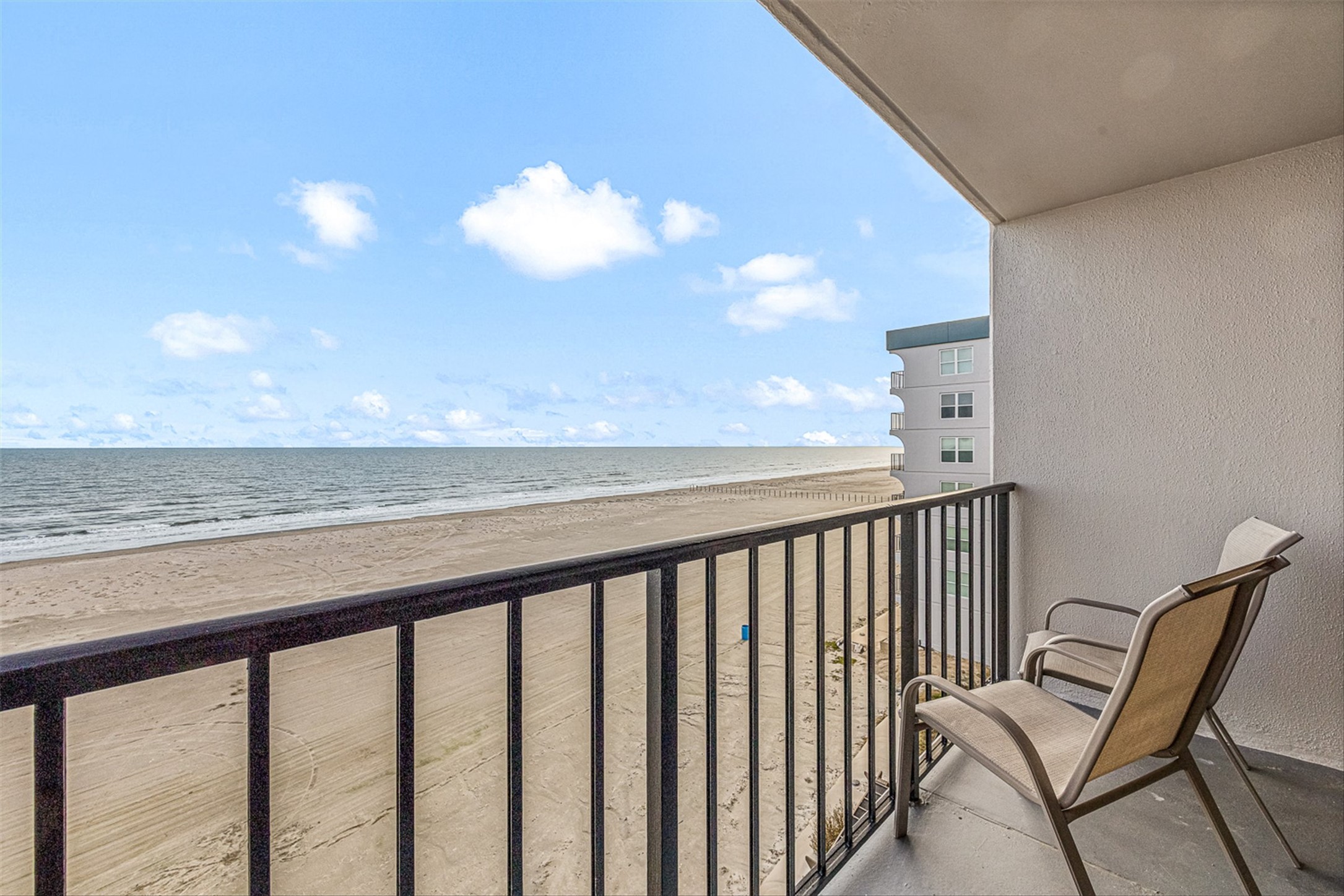 11945 Termini-San Luis Pass Road, Unit 406 Galveston, TX 77554 - Photo 7 of 26 Balcony featuring view of water and beach
