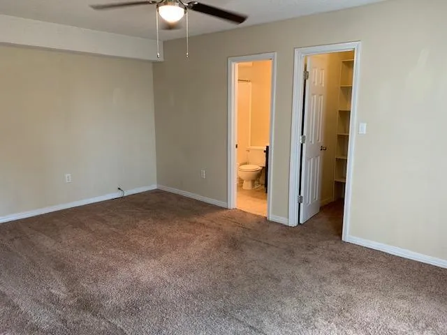 an empty room with a bathroom