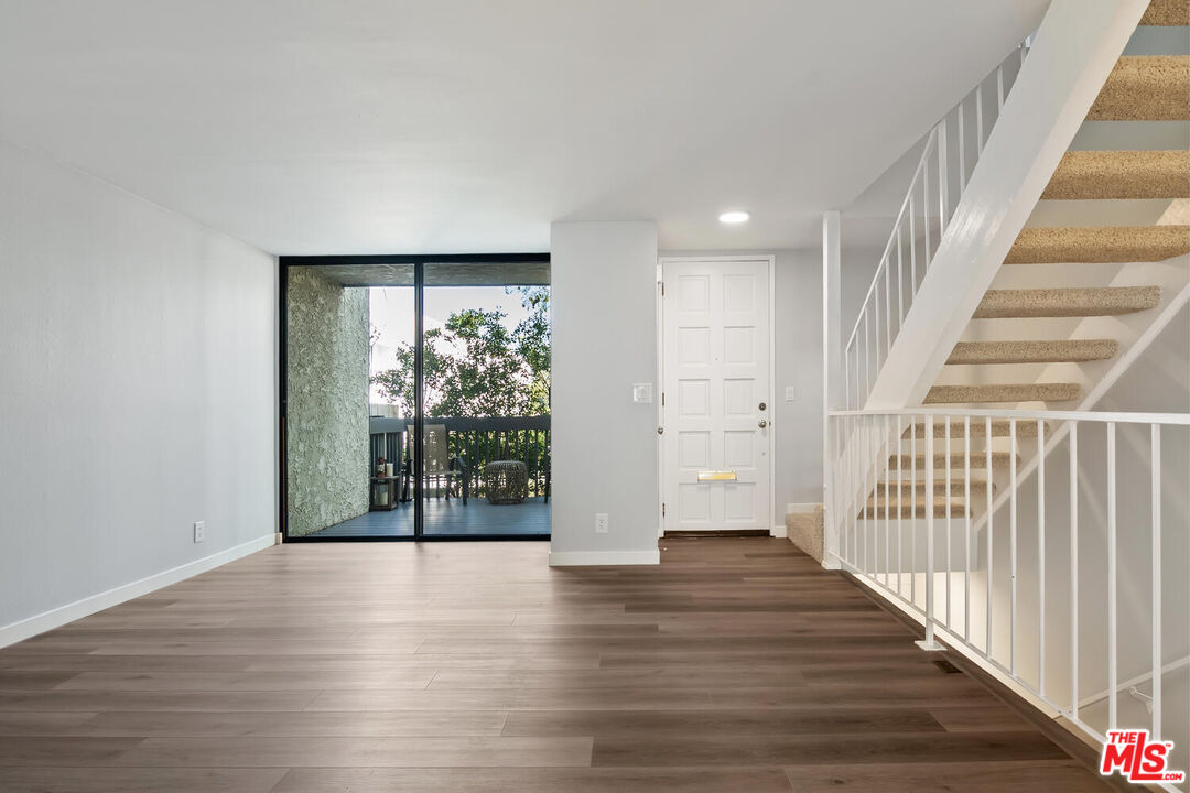 29239 Heathercliff Road, Unit 12 Malibu, CA 90265 - Photo 6 of 32 wooden floor in an empty room with wooden floor