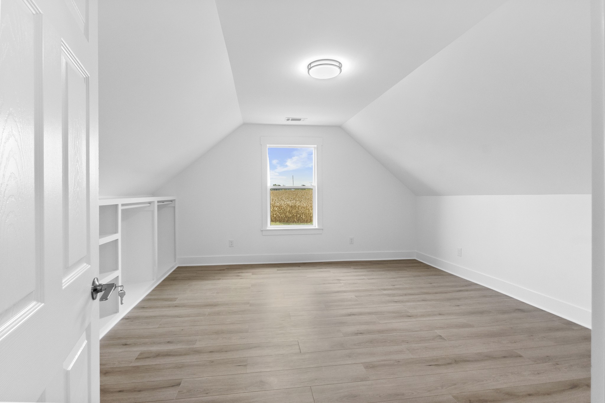 5178 East Robertson Road Cross Plains, TN 37049 - Photo 27 of 44 an empty room with wooden floor and windows
