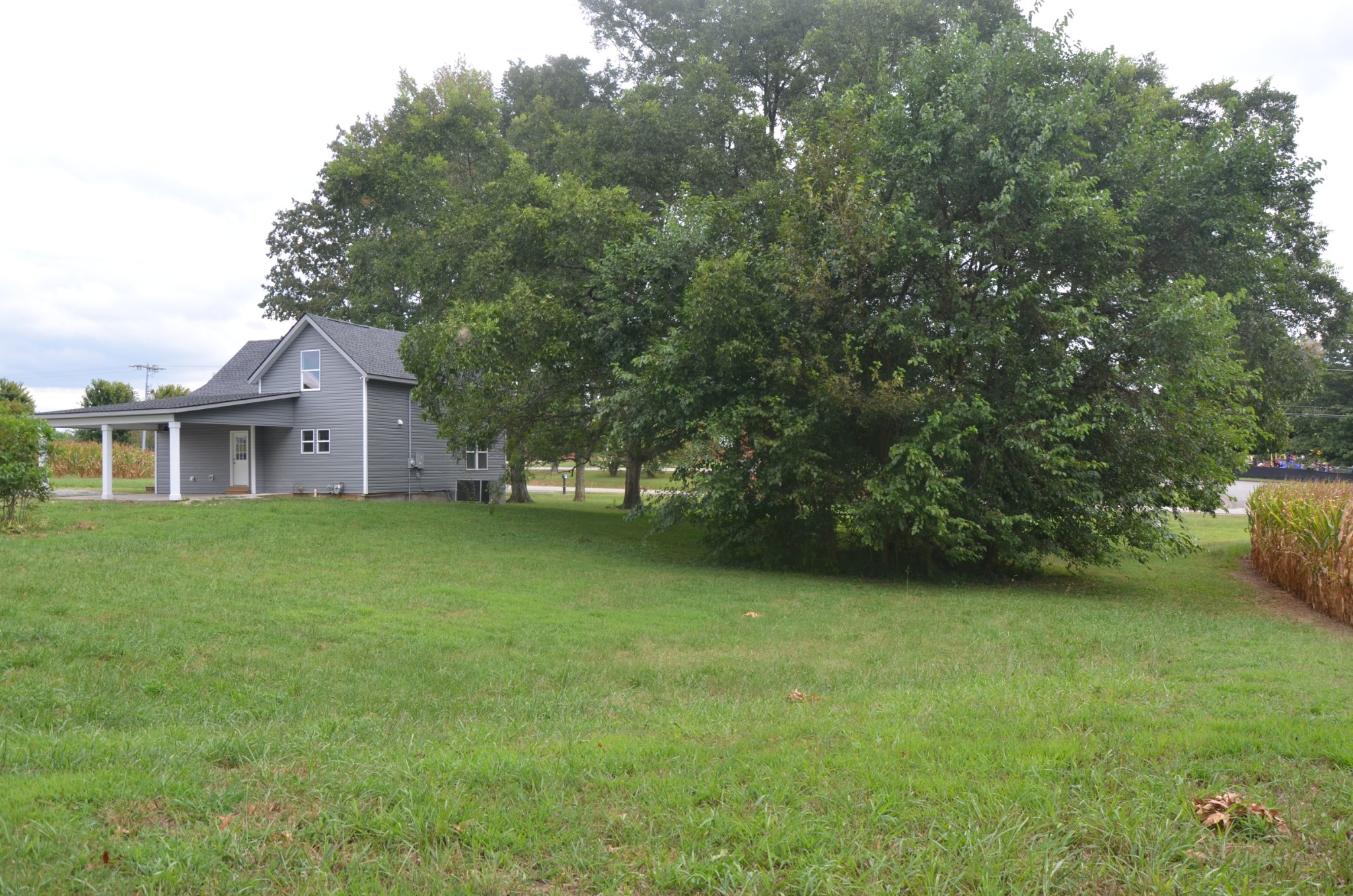 5178 East Robertson Road Cross Plains, TN 37049 - Photo 38 of 44 a front view of a house with a garden
