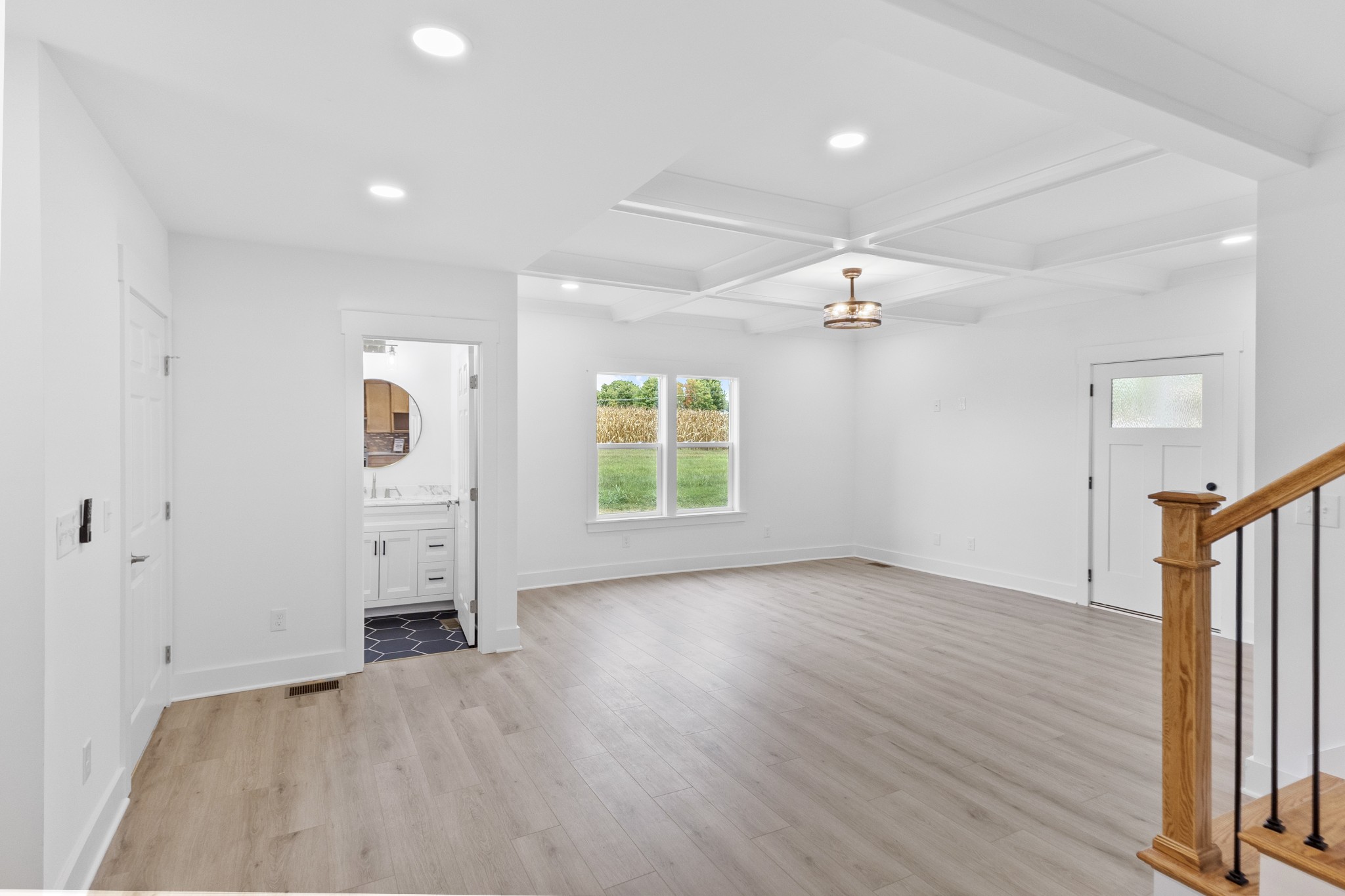 5178 East Robertson Road Cross Plains, TN 37049 - Photo 7 of 44 an empty room with wooden floor cabinet and windows