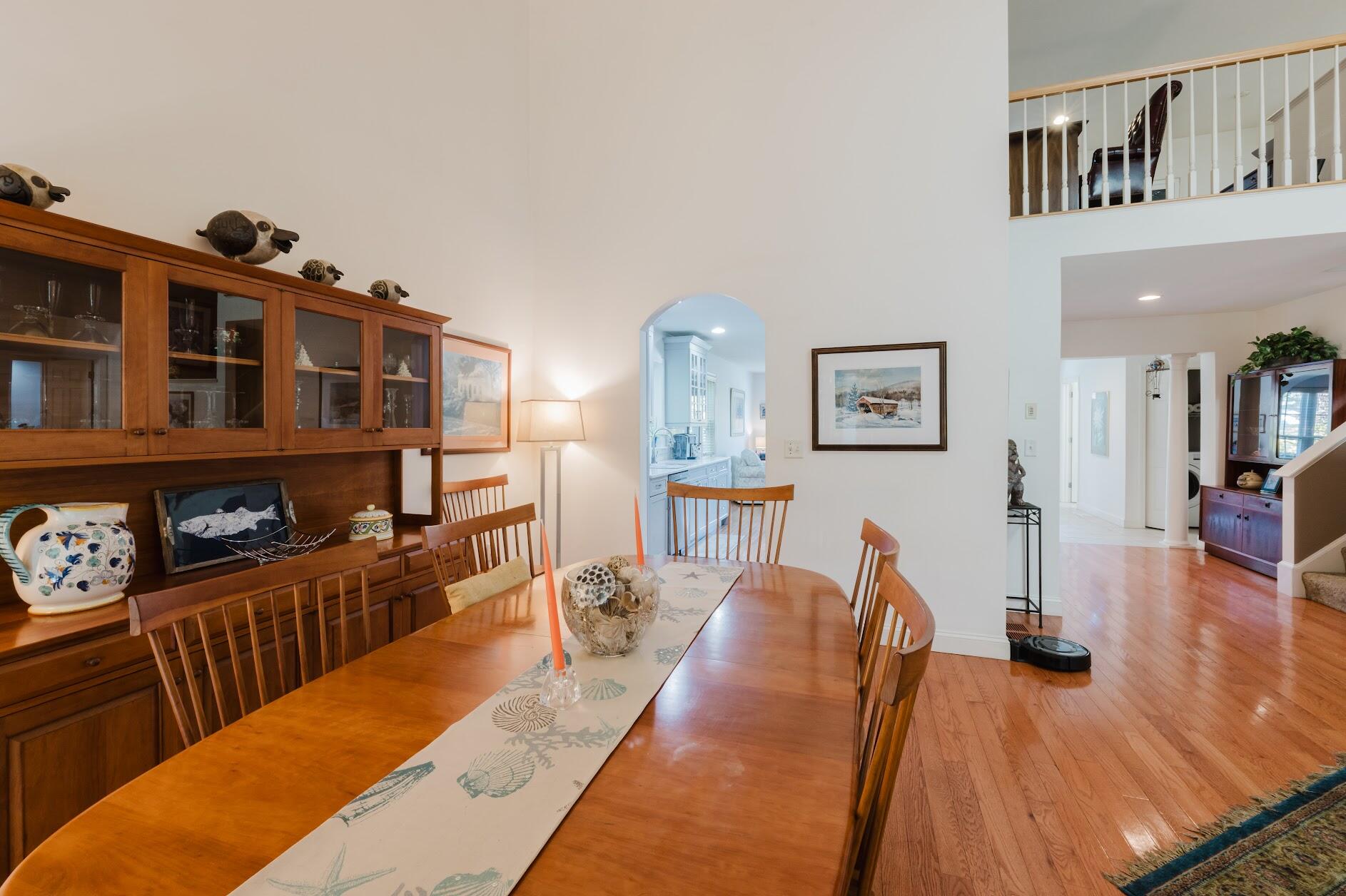 22 Stratford Ridge, Unit 22 Mashpee, MA 02649 - Photo 16 of 40 a living room with furniture and a wooden floor