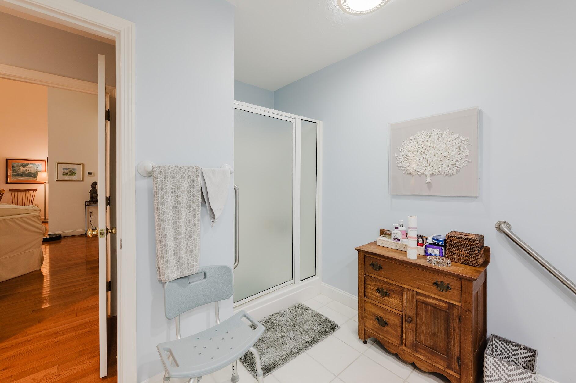 22 Stratford Ridge, Unit 22 Mashpee, MA 02649 - Photo 26 of 40 a room with furniture and a wooden floor