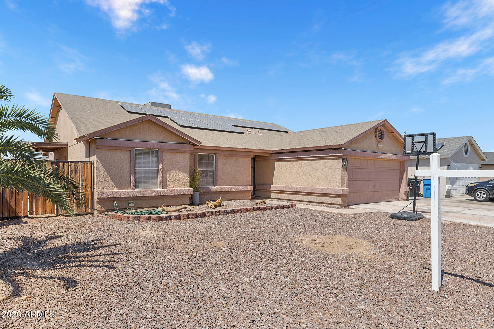 9002 West Coronado Road Phoenix, AZ 85037 - Photo 8 of 54 a front view of a house with a yard
