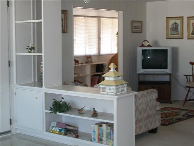 7467 Mission Gorge Road, Unit 83 Santee, CA 92071 - Photo 13 of 24 View from sofa toward TV, entry of sun room.