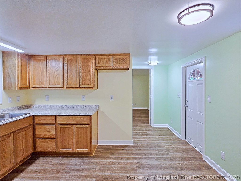 1031 Pine Acres Road White Oak, NC 28399 - Photo 11 of 29 a view of a kitchen with wooden floor