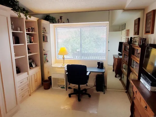 a room with furniture and screen