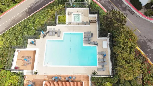 aerial view of a house with a yard