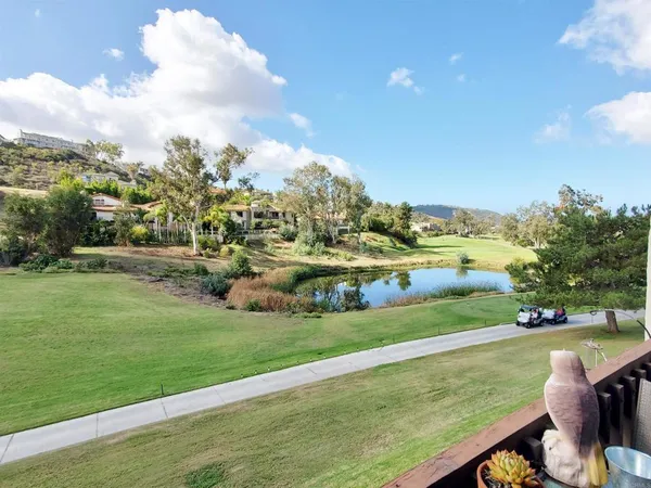 a view of a golf course with a lake