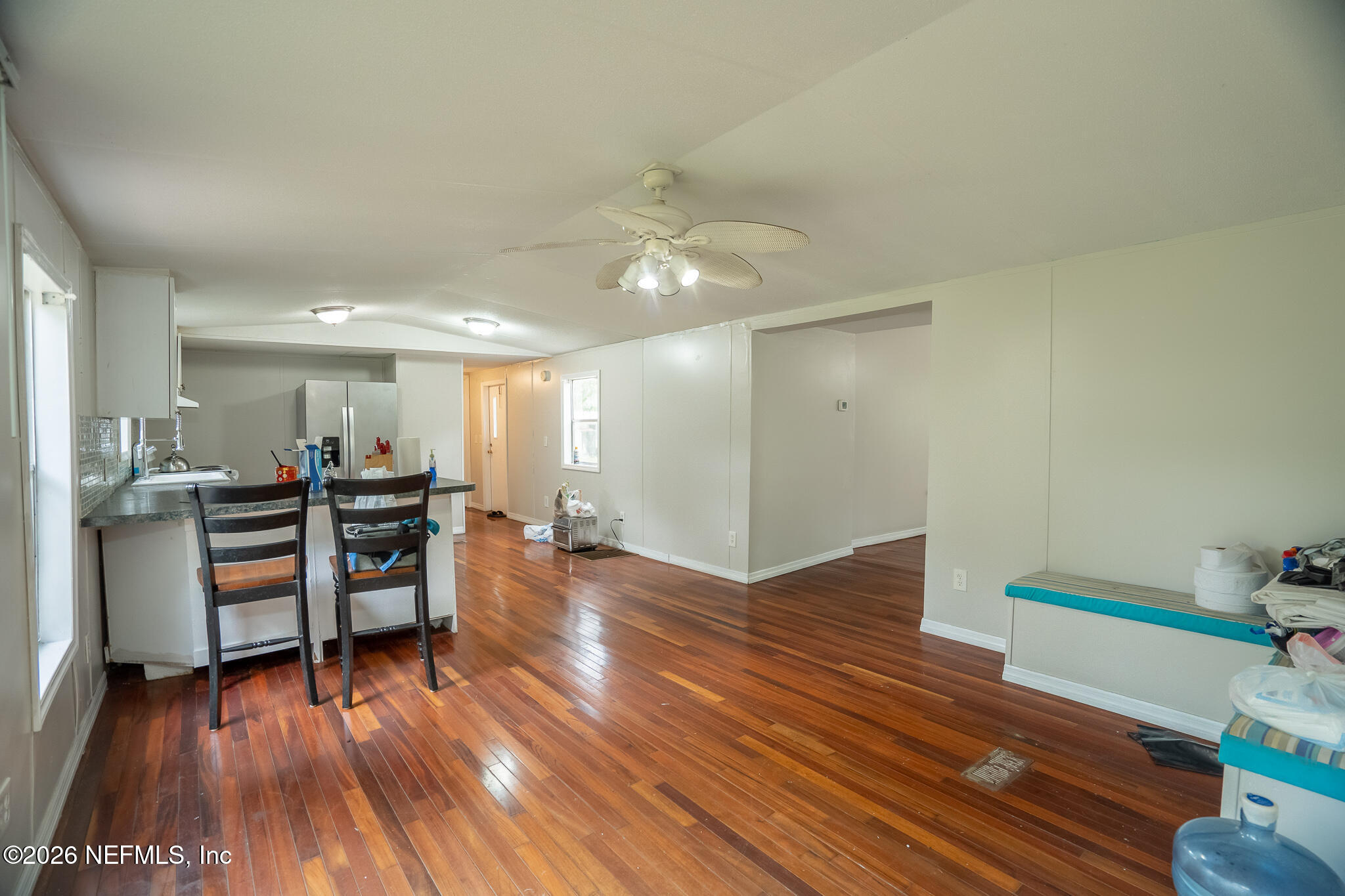 3180 Pacetti Road, Unit A St. Augustine, FL 32092 - Photo 11 of 23 a view of a livingroom with furniture wooden floor and a ceiling fan