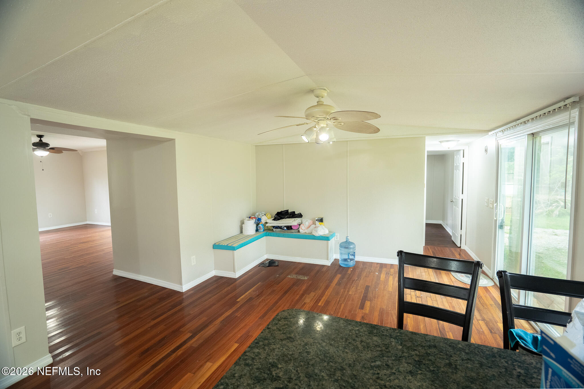 3180 Pacetti Road, Unit A St. Augustine, FL 32092 - Photo 12 of 23 a room with wooden floor and furniture