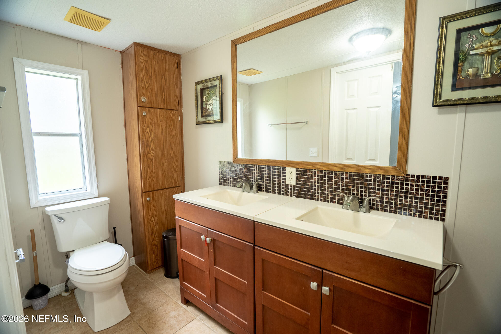 3180 Pacetti Road, Unit A St. Augustine, FL 32092 - Photo 15 of 23 a bathroom with a sink a toilet and shower