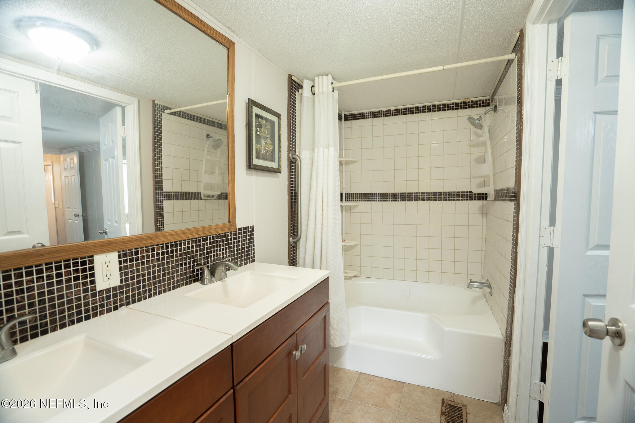 3180 Pacetti Road, Unit A St. Augustine, FL 32092 - Photo 16 of 23 a bathroom with a bathtub and a sink